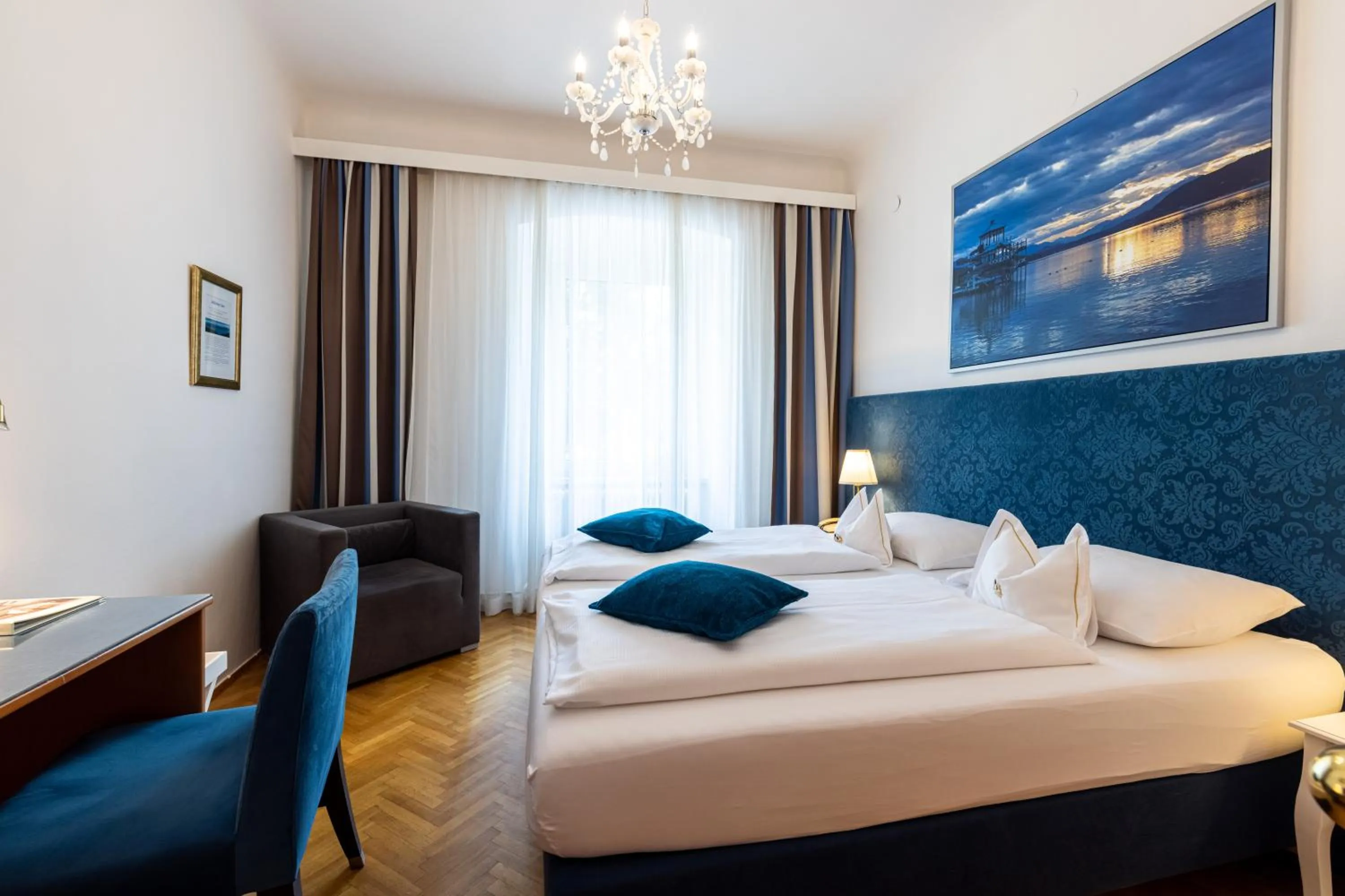 Photo of the whole room, Bed in Boutique Hotel Goldenes Lamm Villach