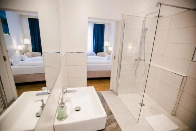 Photo of the whole room, Bed in Boutique Hotel Goldenes Lamm Villach