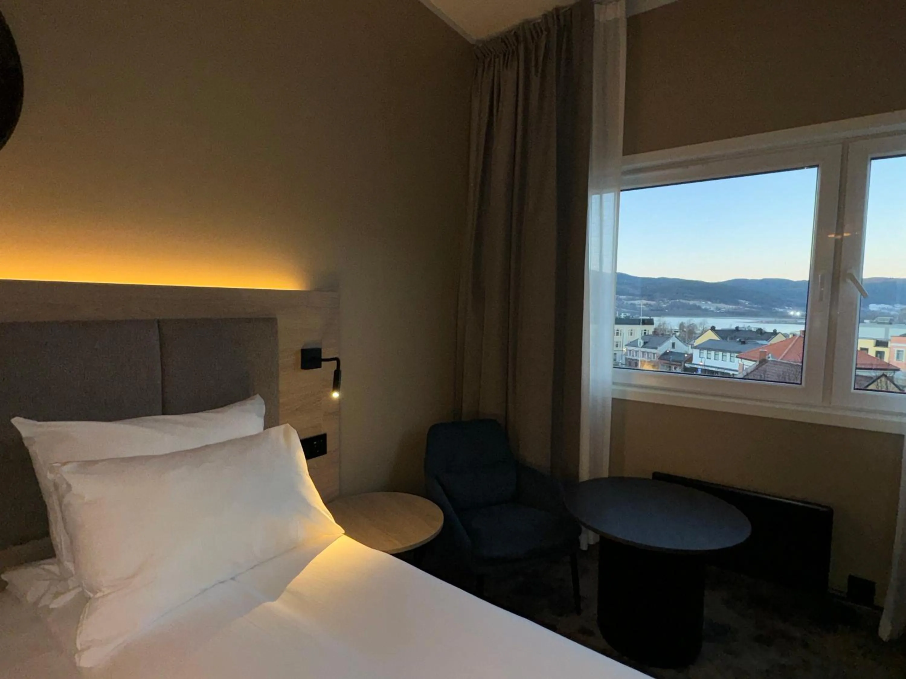 Seating area, Bed in Notodden Hotel