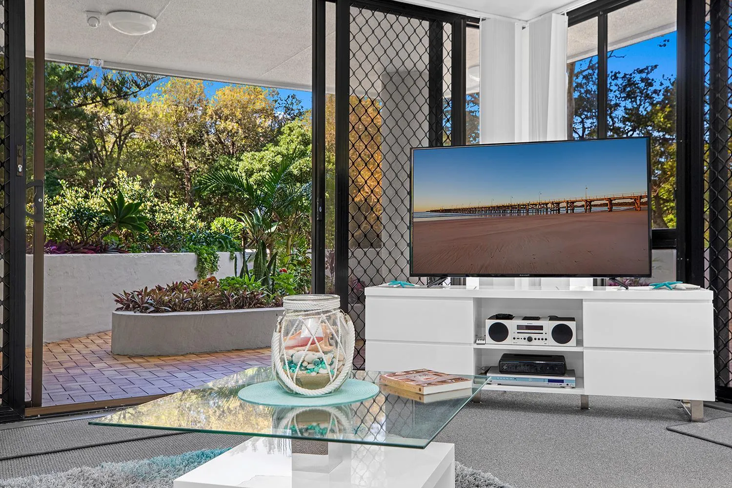 Communal lounge/ TV room in Pacific Towers Beach Resort