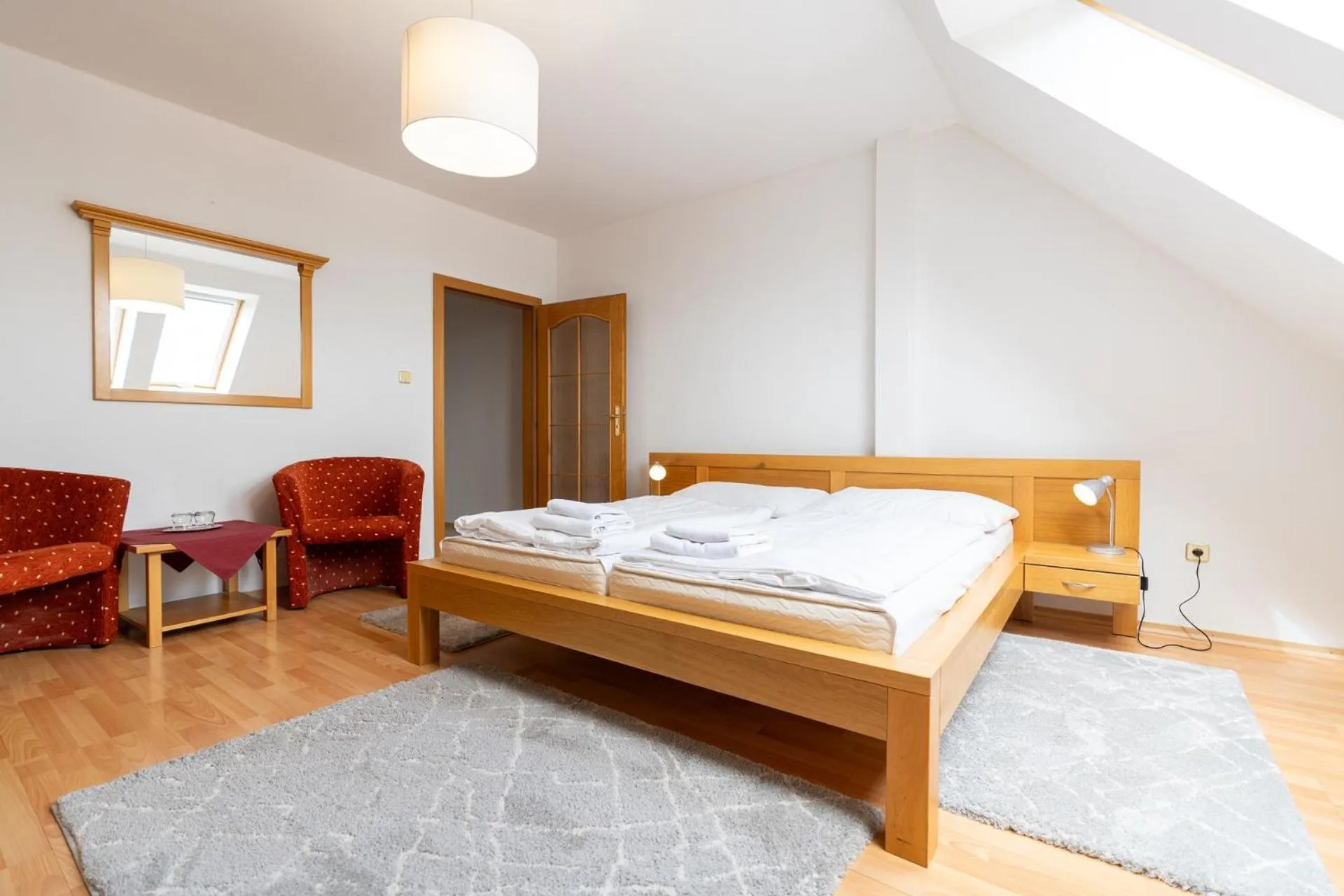 Living room, Bed in Hotel Arkada