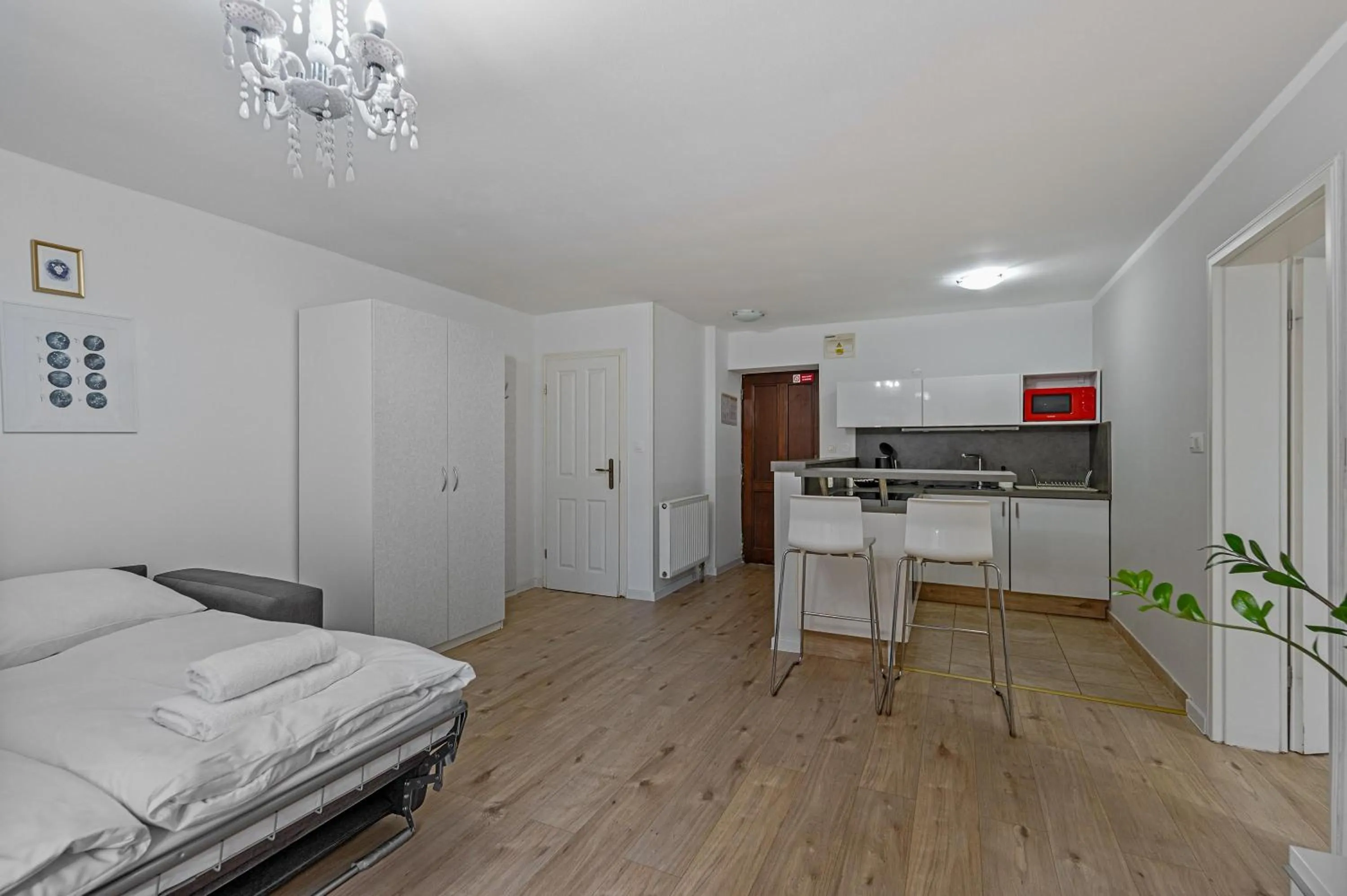 Kitchen or kitchenette, Bed in Garni Hotel VIRGO