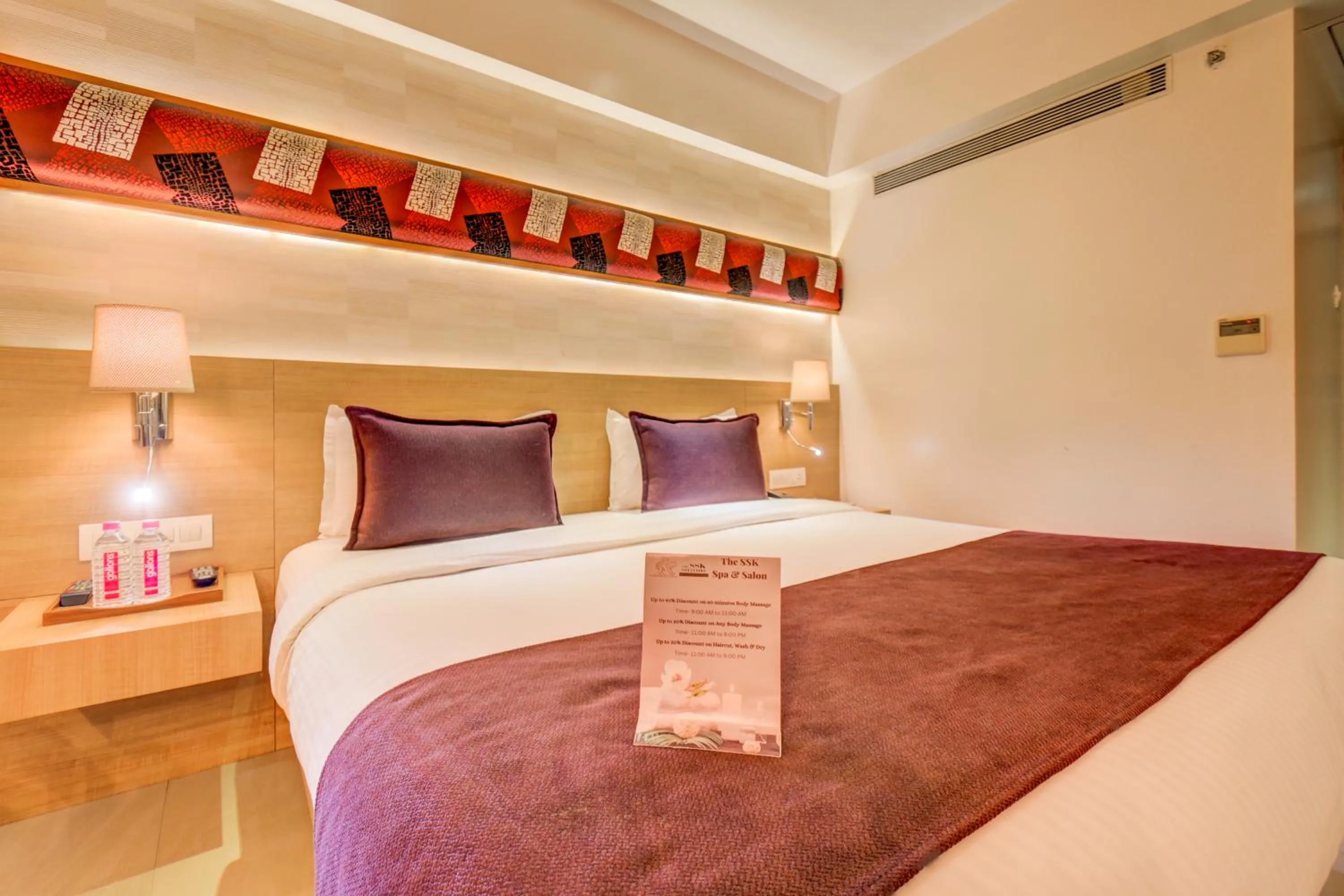 Bed in The SSK Solitaire Hotel & Banquets