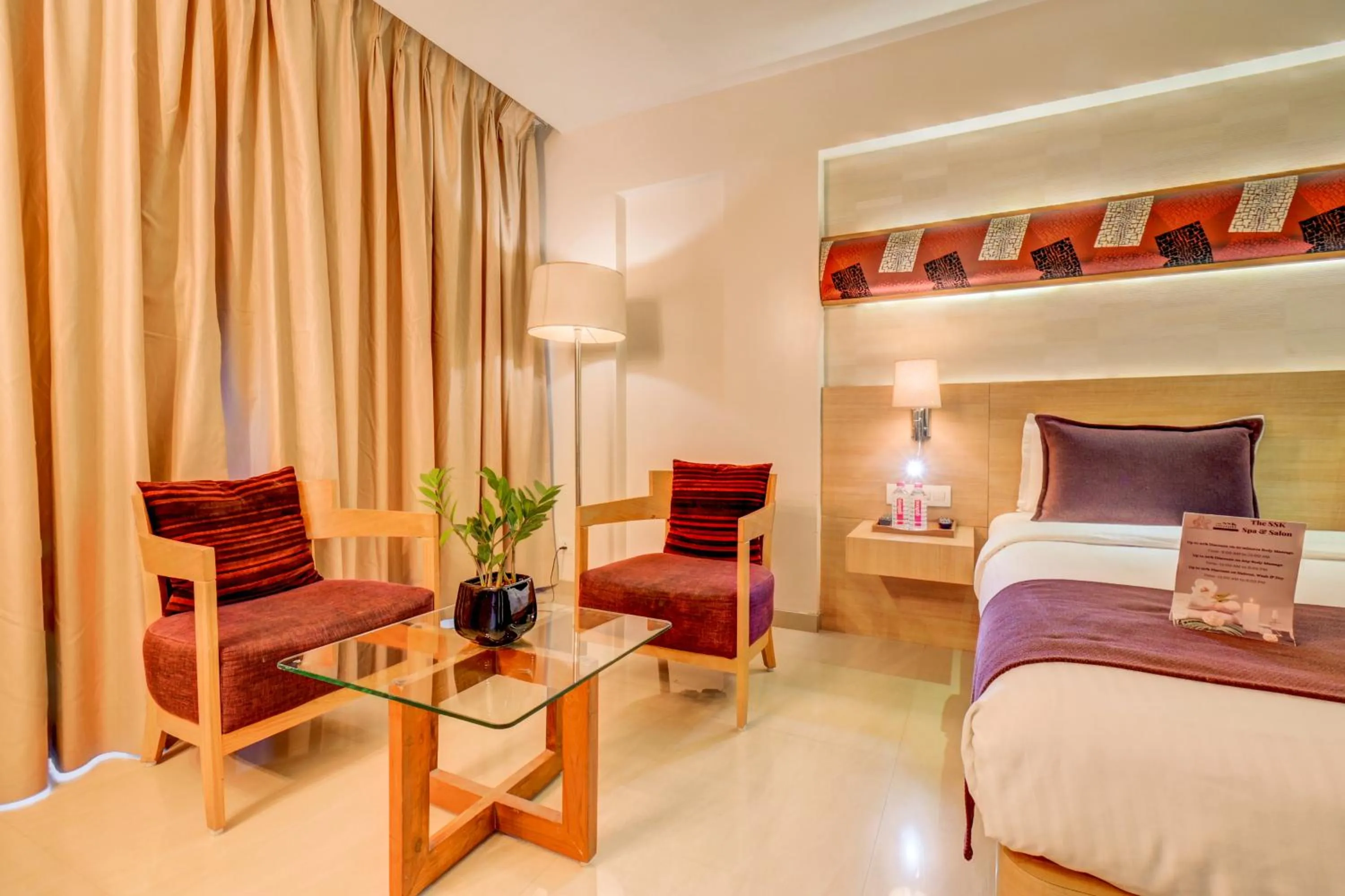 Seating area, Bed in The SSK Solitaire Hotel & Banquets