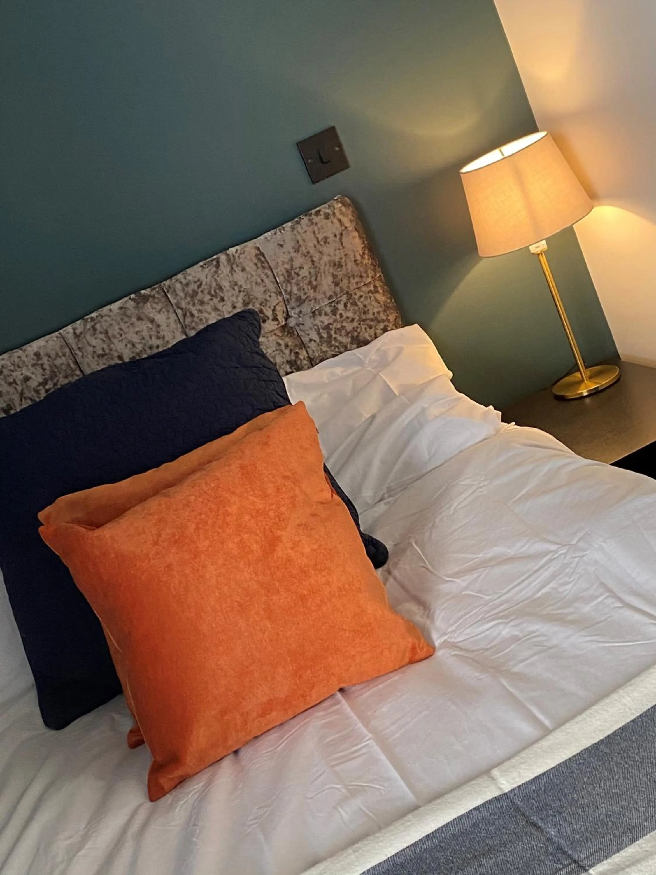 Bed, Seating Area in Raby Apartment