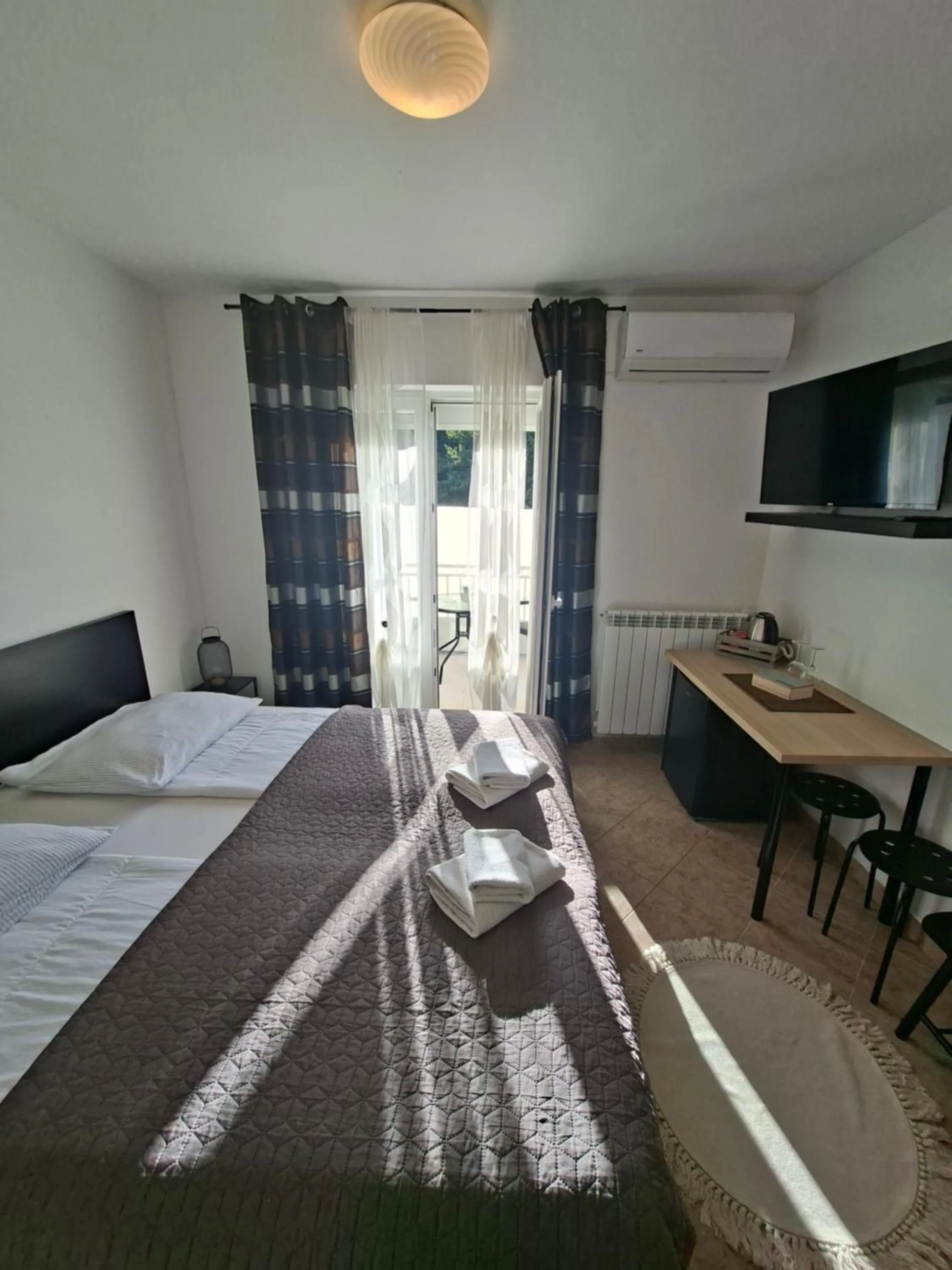 Bed in Martina Guest house-Rooms