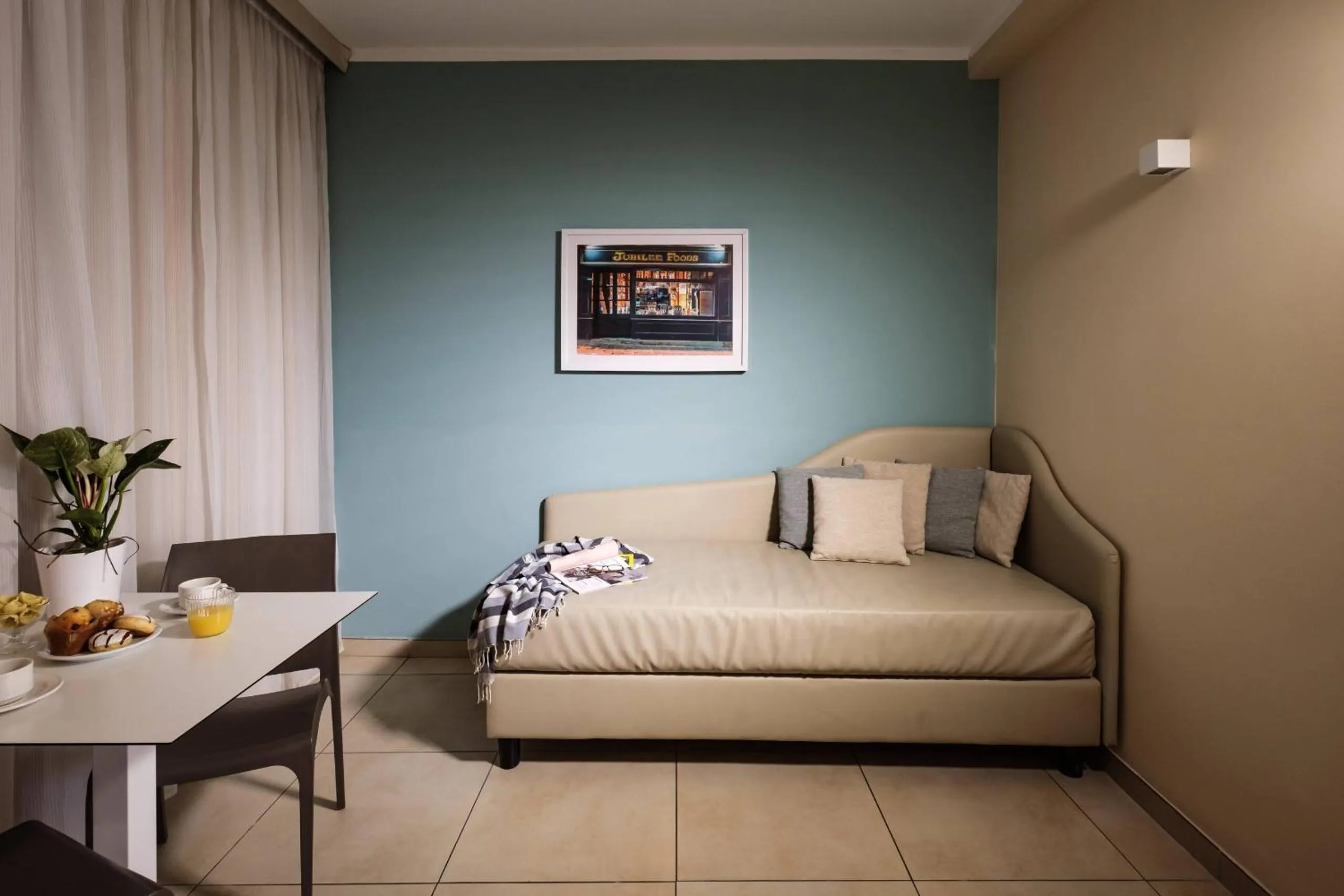 Bedroom in 115 The Strand Hotel by NEU Collective