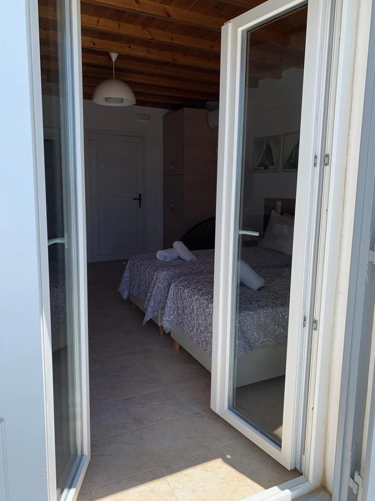 Bed in Sea Wind Villas and Suites