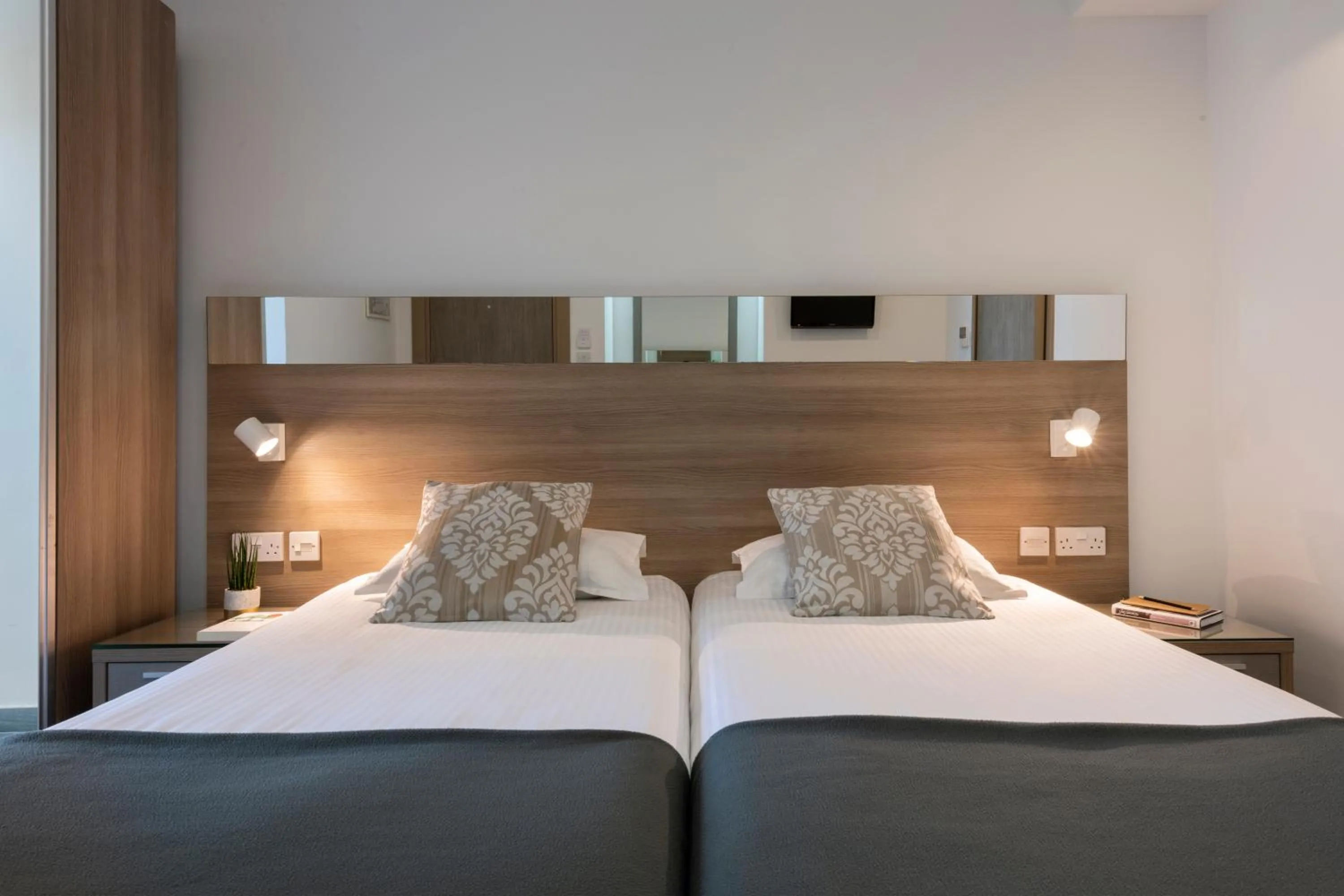 Bed in Plaza Regency Hotels