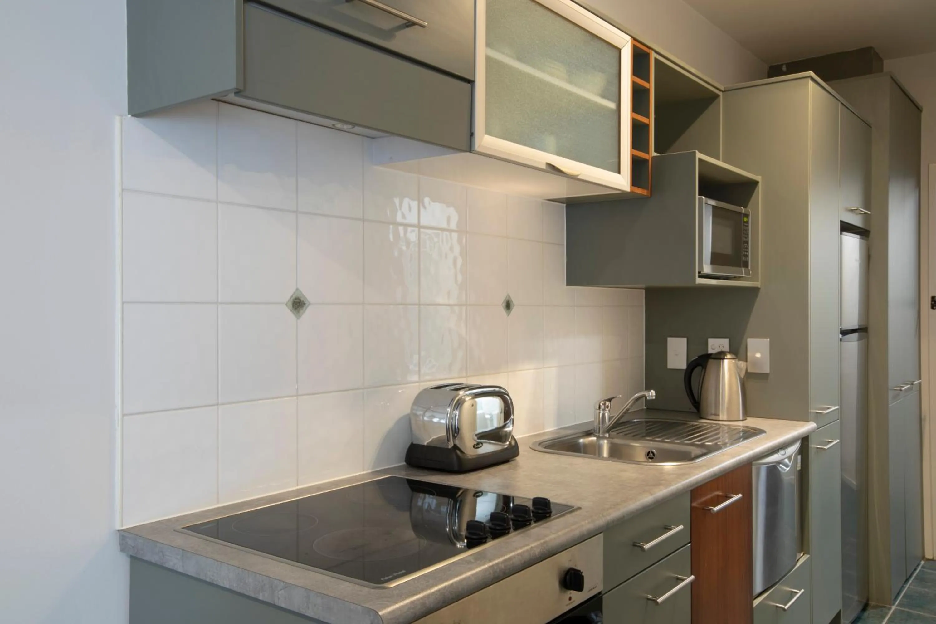 Kitchen or kitchenette in Quest Atrium Apartment Hotel