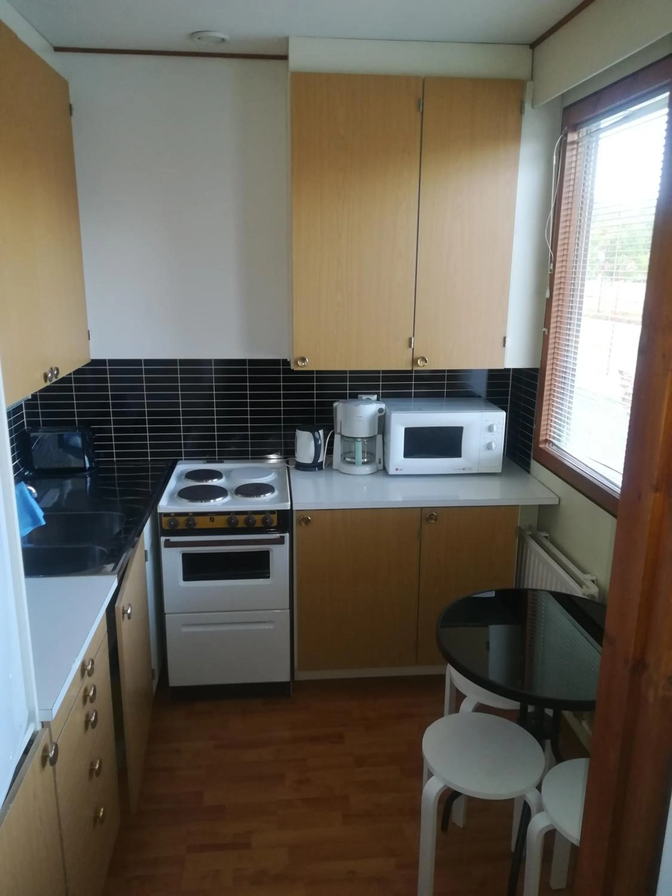 Kitchen or kitchenette in Hotelli Pogostan Hovi