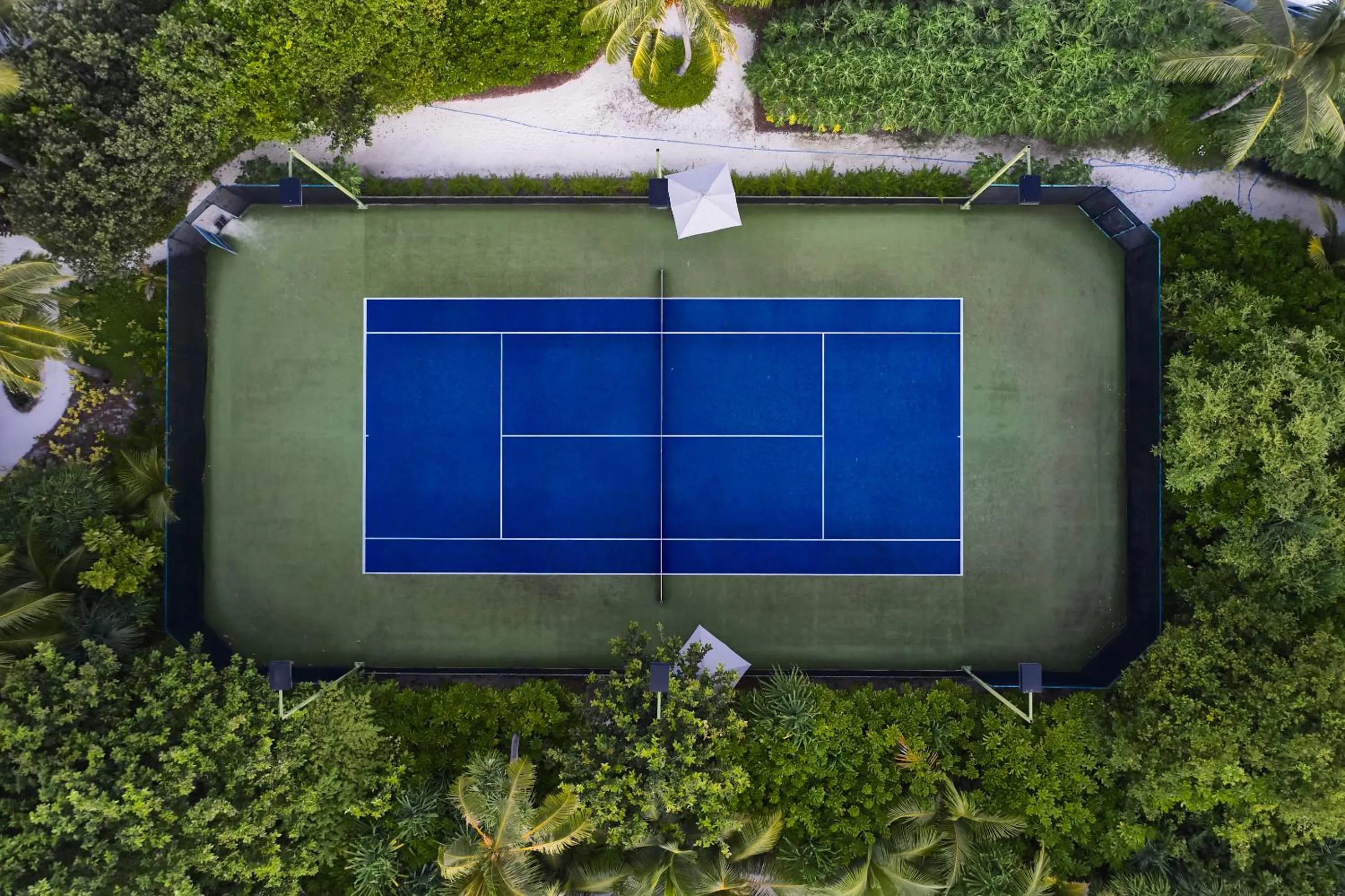 Tennis court in Finolhu, A Seaside Collection Resort, a Member of Design Hotels