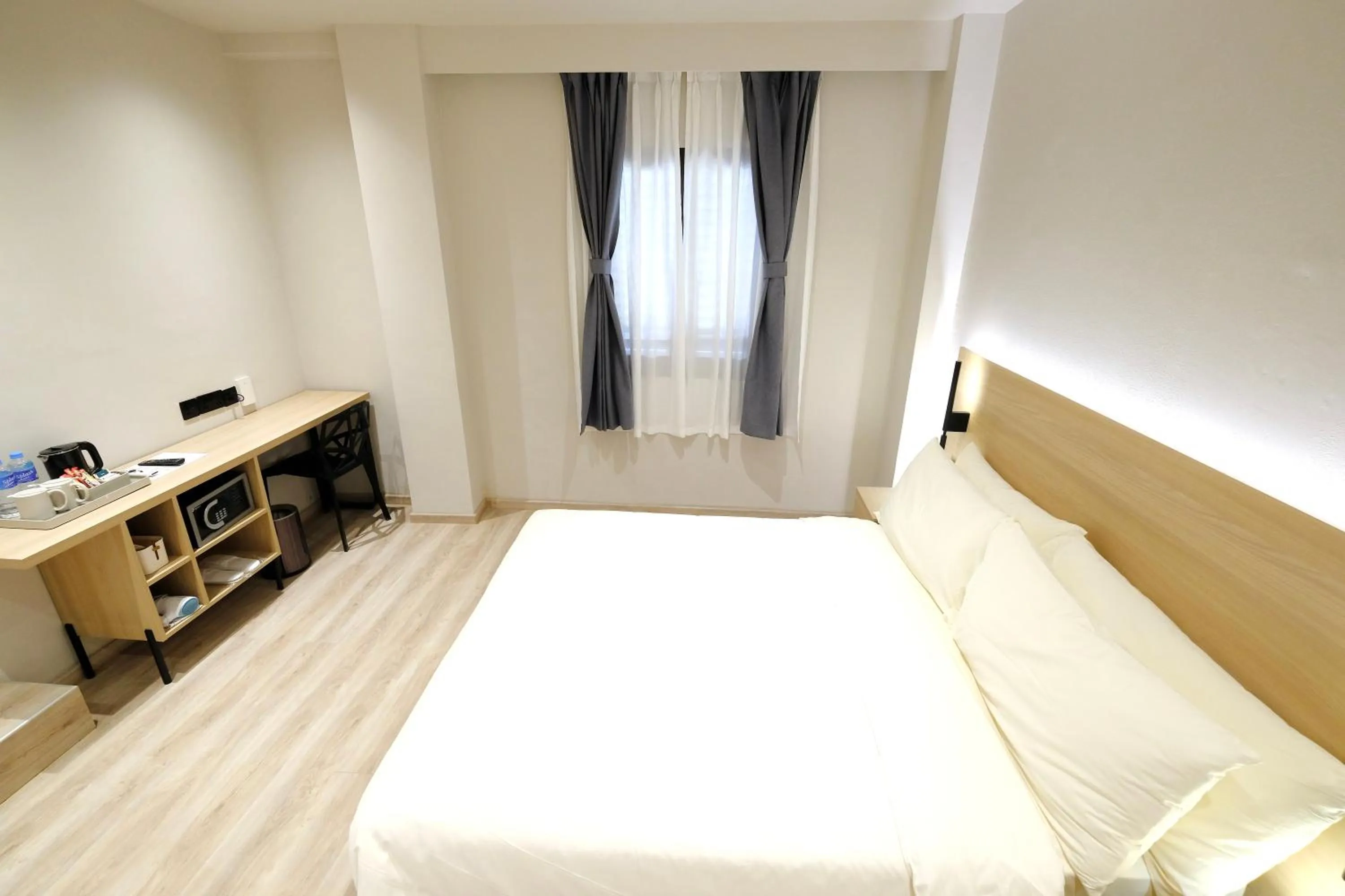 Bed in Rest Bugis Hotel