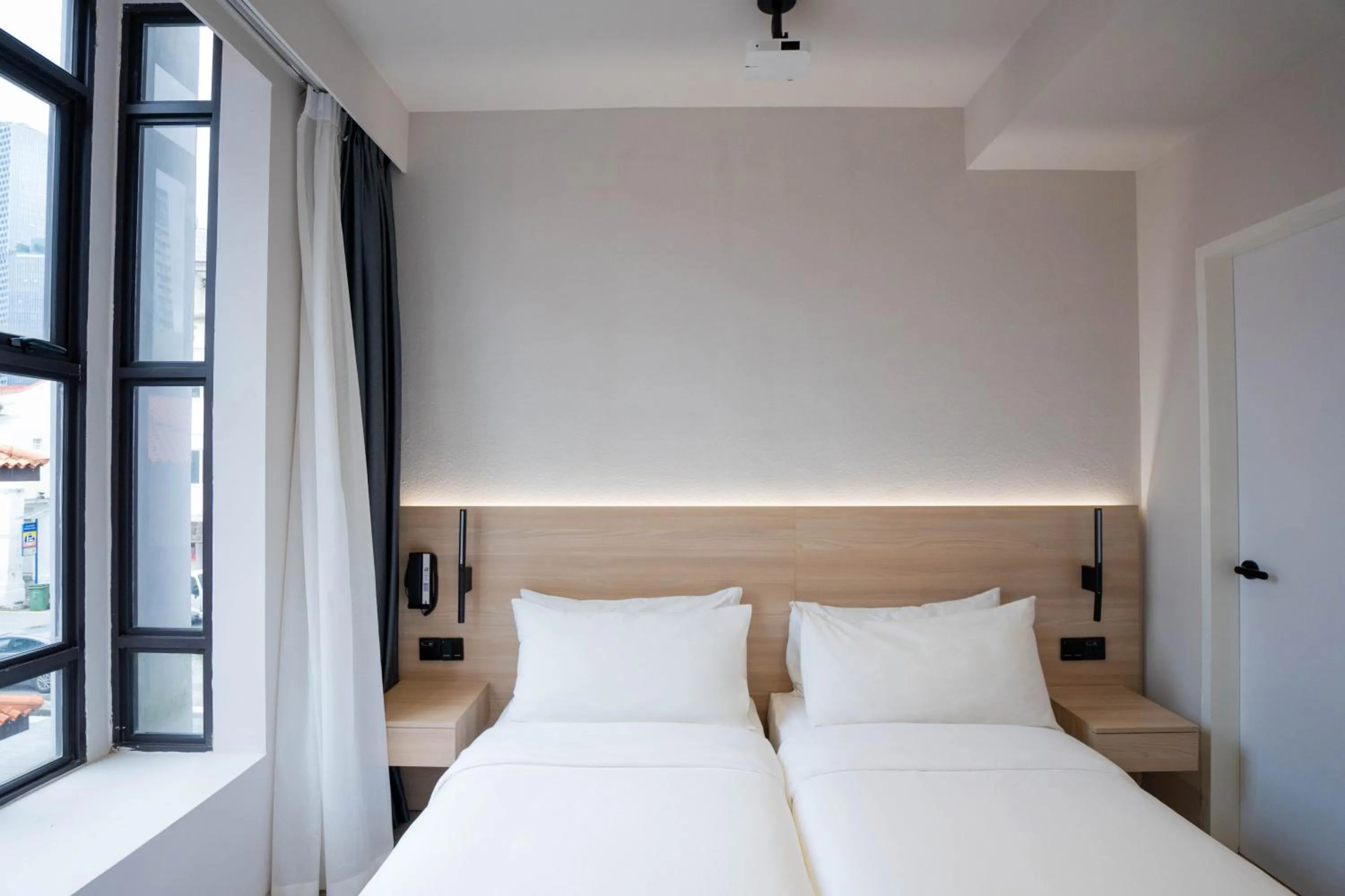 Bed in Rest Bugis Hotel