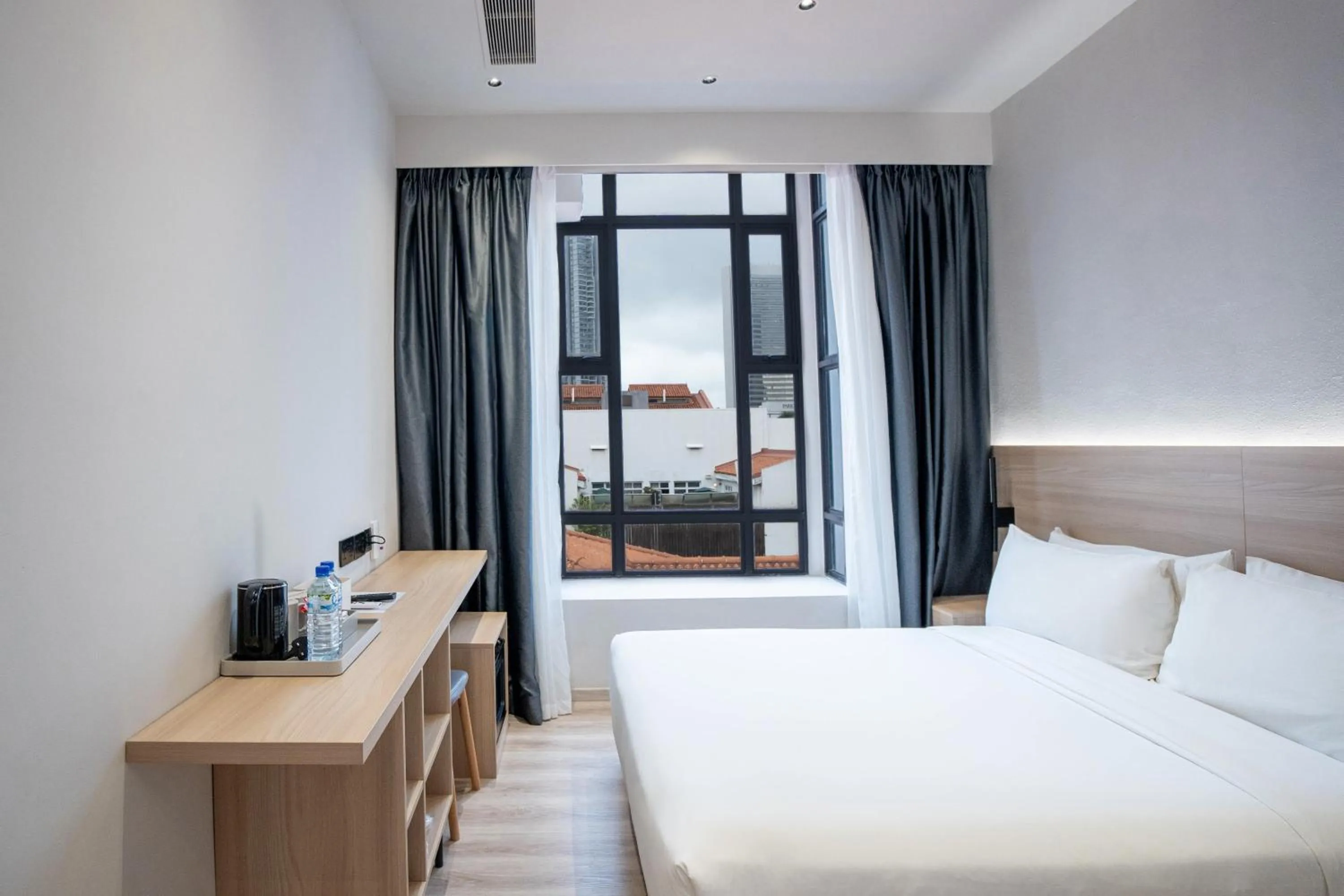 Bed in Rest Bugis Hotel