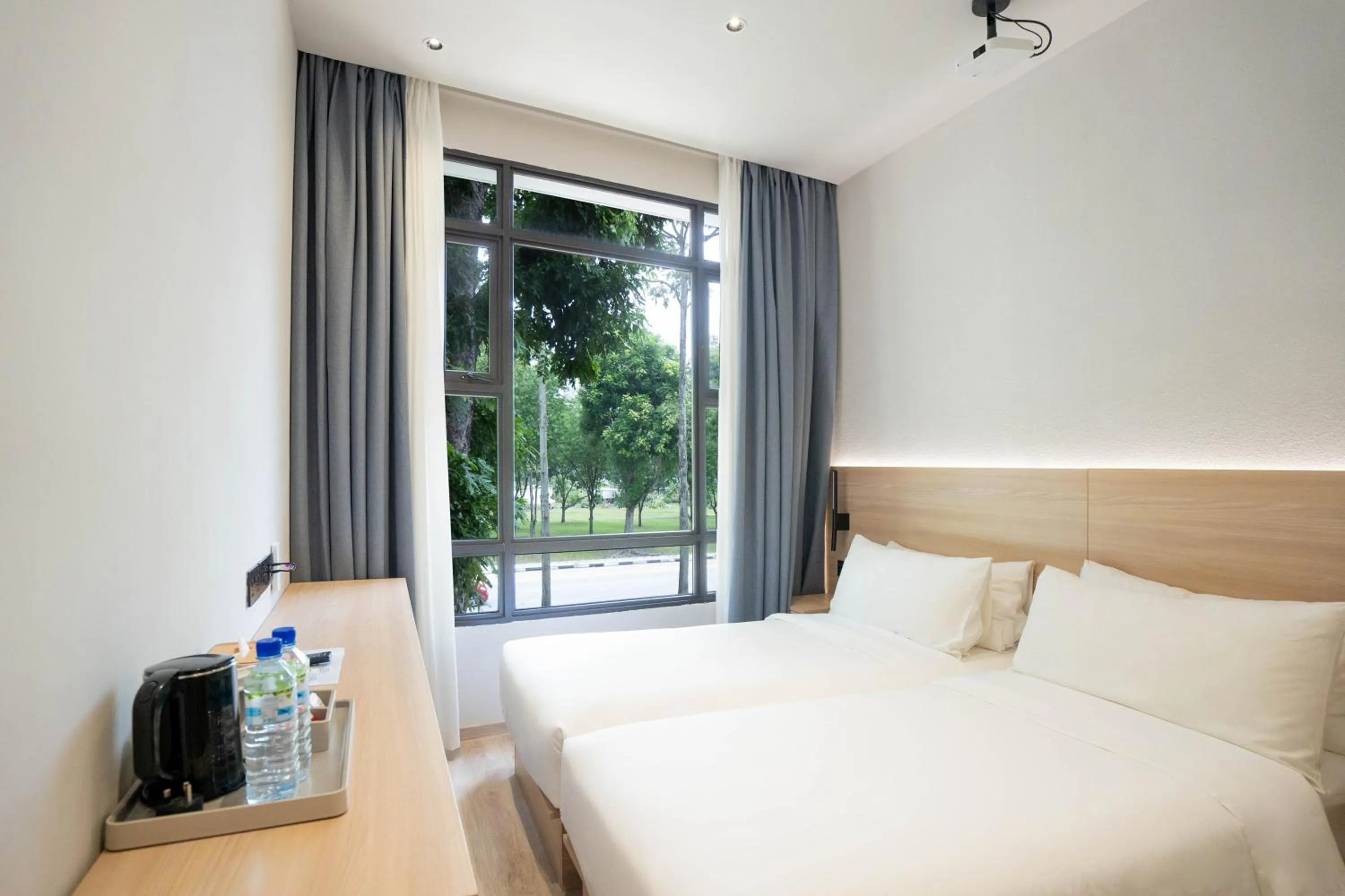 Bed in Rest Bugis Hotel