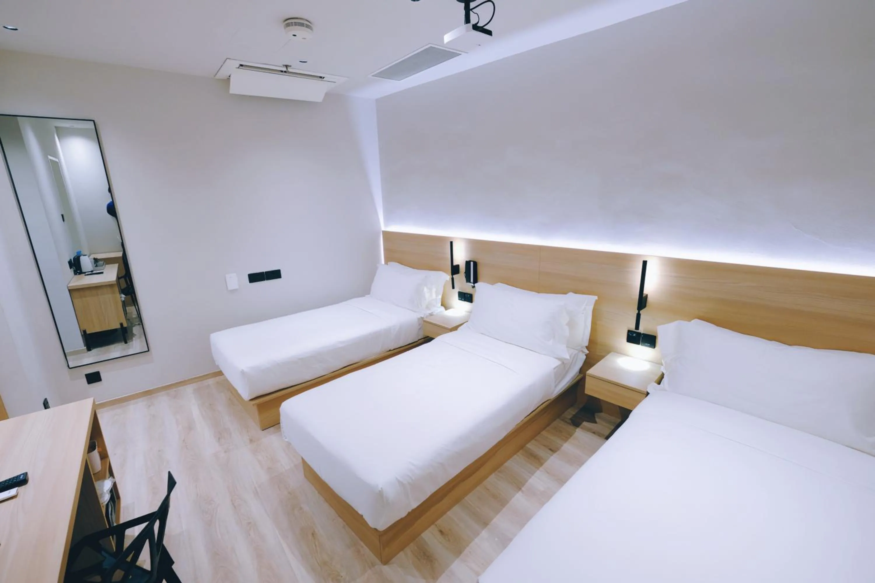 Bed in Rest Bugis Hotel