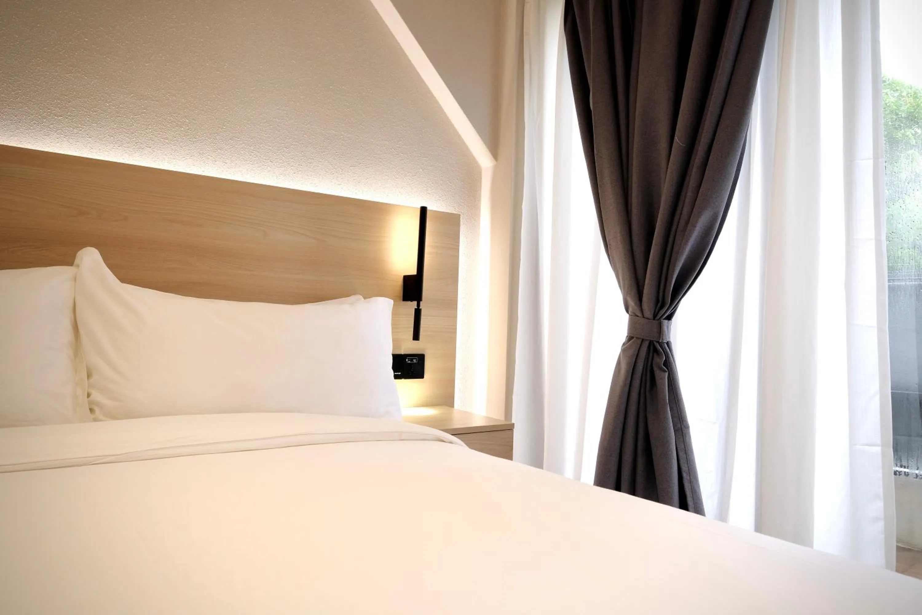 Bed in Rest Bugis Hotel