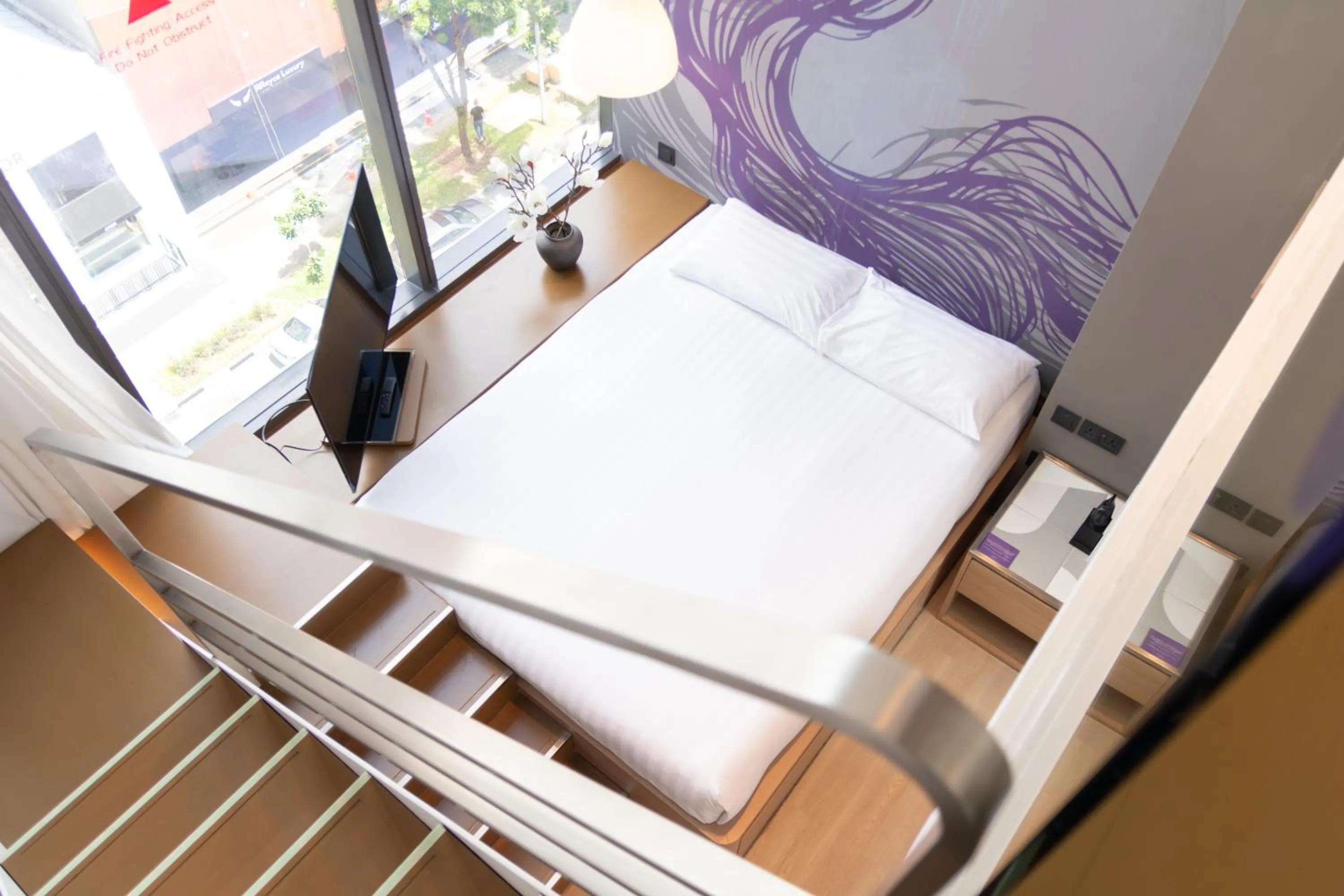 Bed in Studio M Hotel