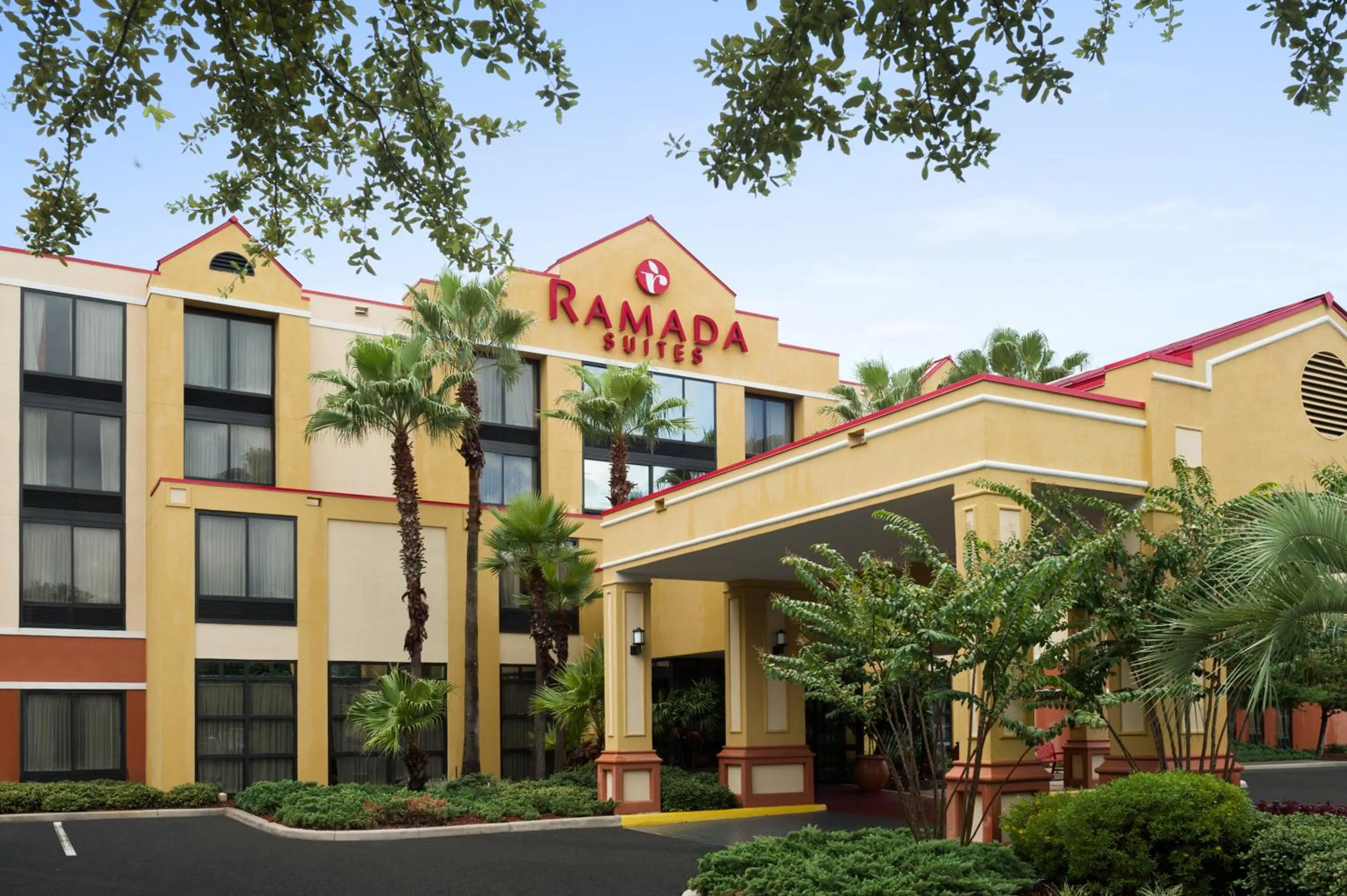 Facade/entrance in Ramada by Wyndham Suites Orlando Airport- Free Airport Shuttle