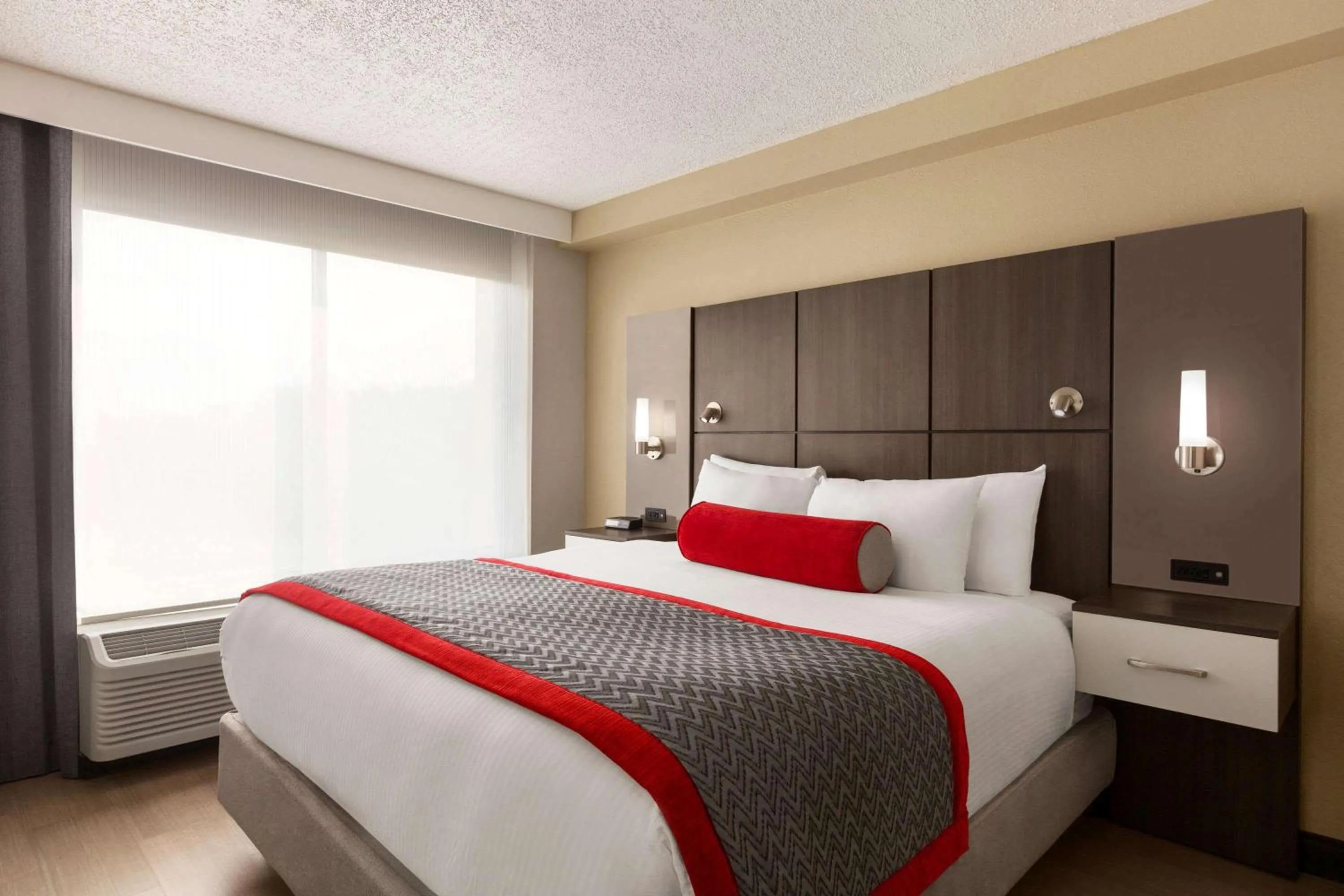 Photo of the whole room, Bed in Ramada by Wyndham Suites Orlando Airport- Free Airport Shuttle