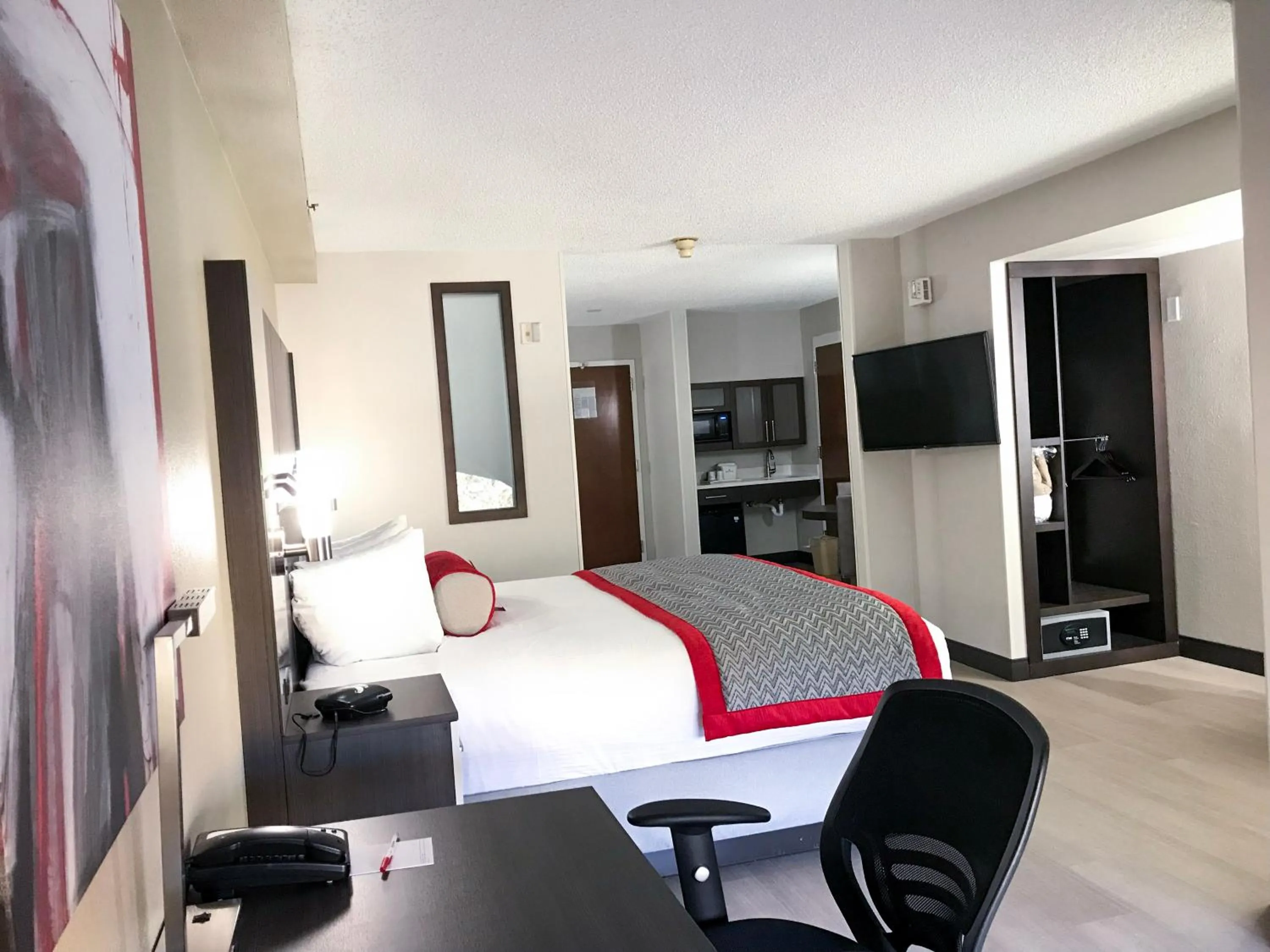 Photo of the whole room, Bed in Ramada by Wyndham Suites Orlando Airport- Free Airport Shuttle