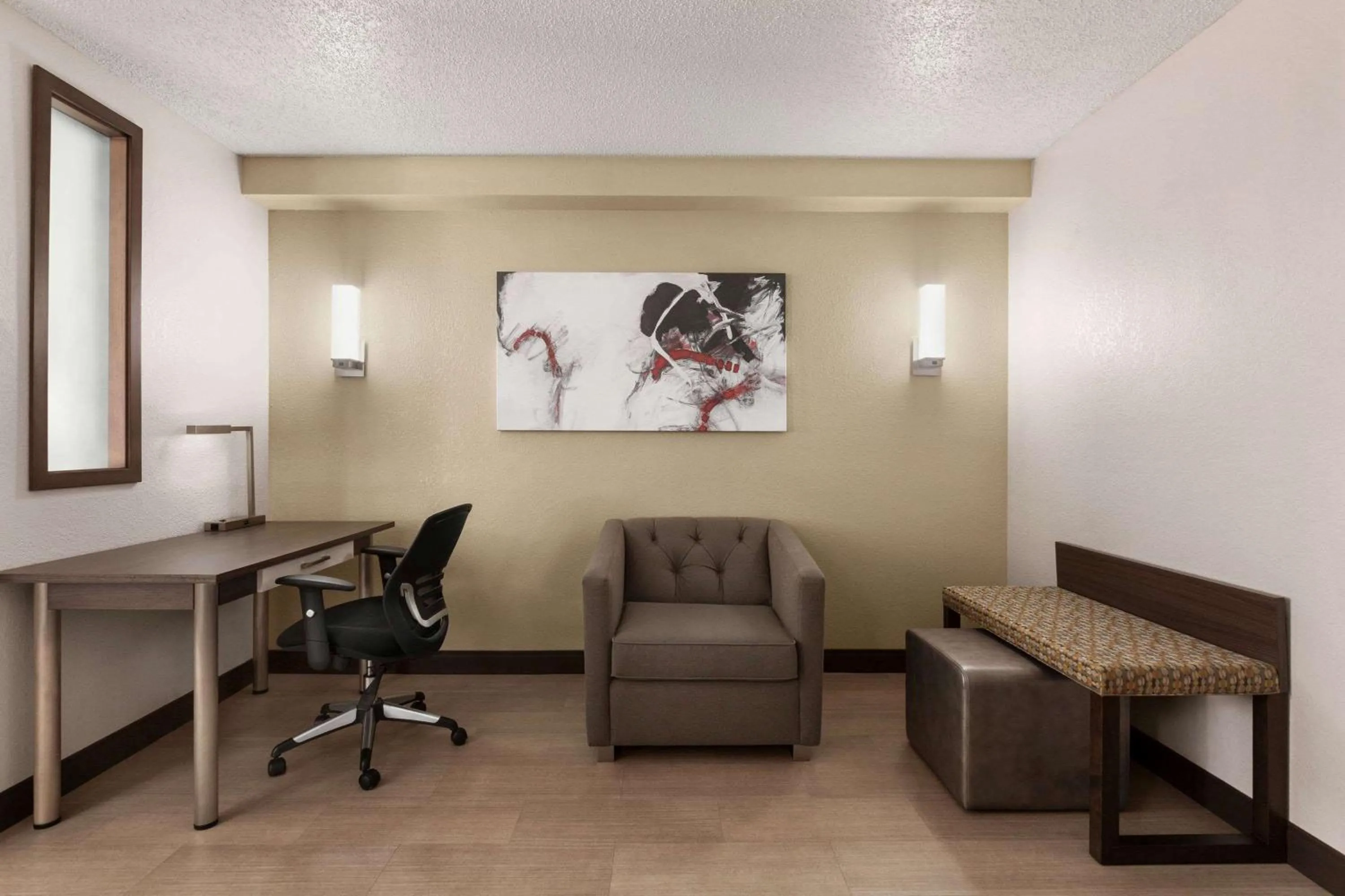 Photo of the whole room in Ramada by Wyndham Suites Orlando Airport- Free Airport Shuttle