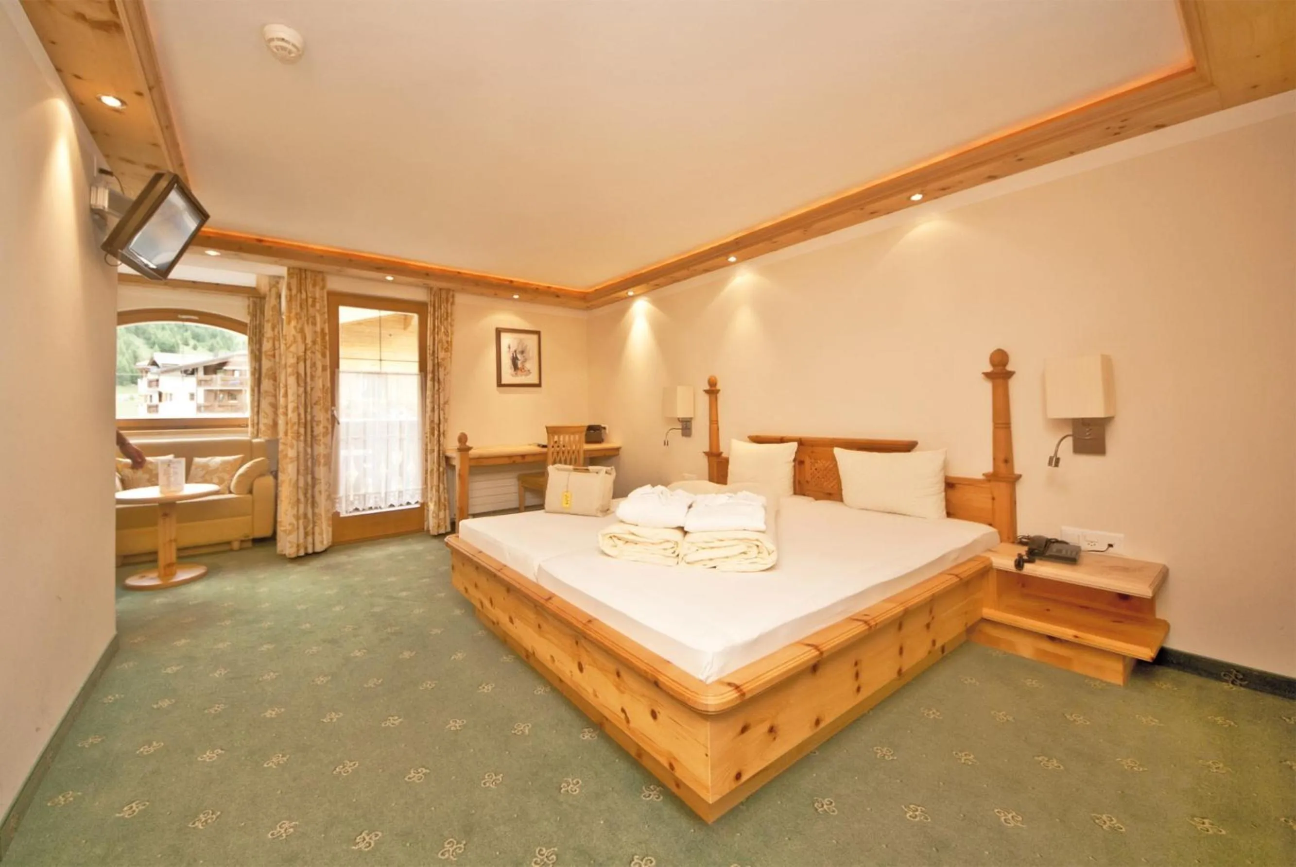 Bed in Hotel des Alpes