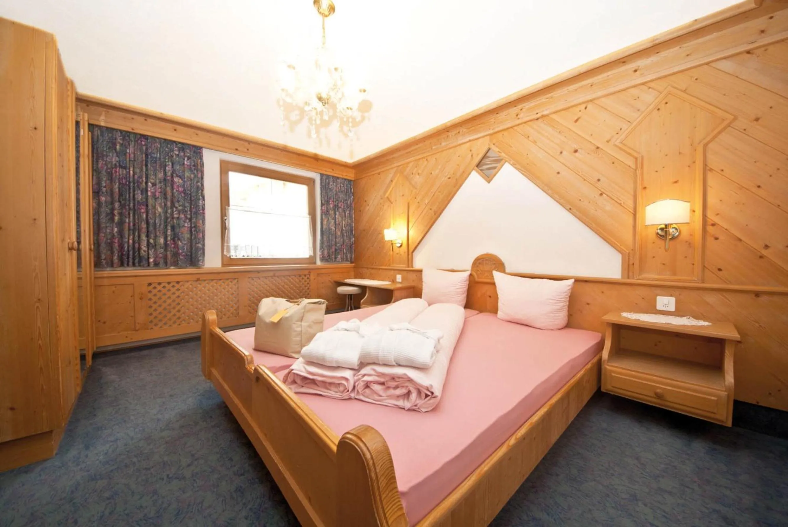 Bed in Hotel des Alpes