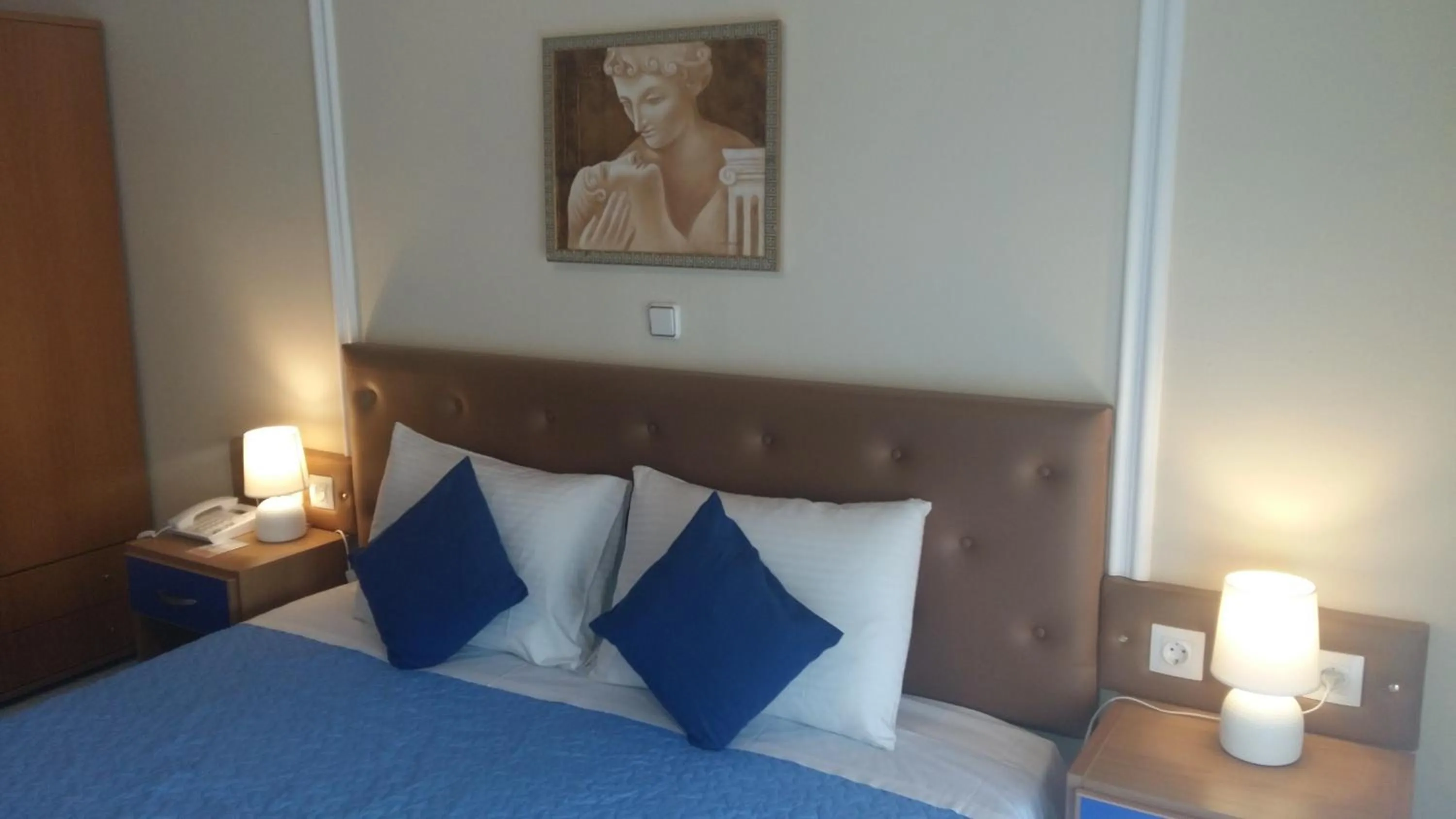 Bed in Pantheon Deluxe Apartments