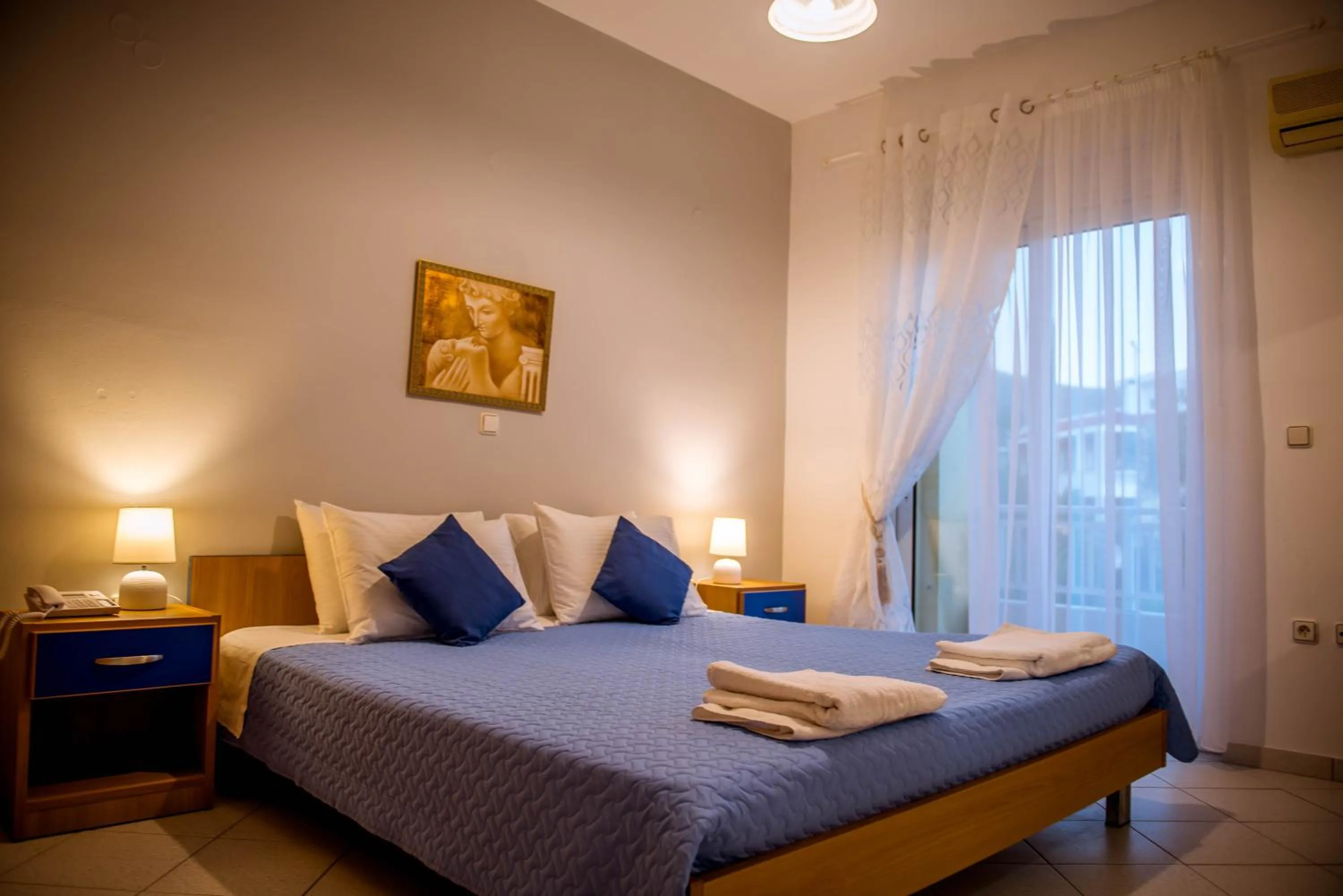 Bed in Pantheon Deluxe Apartments