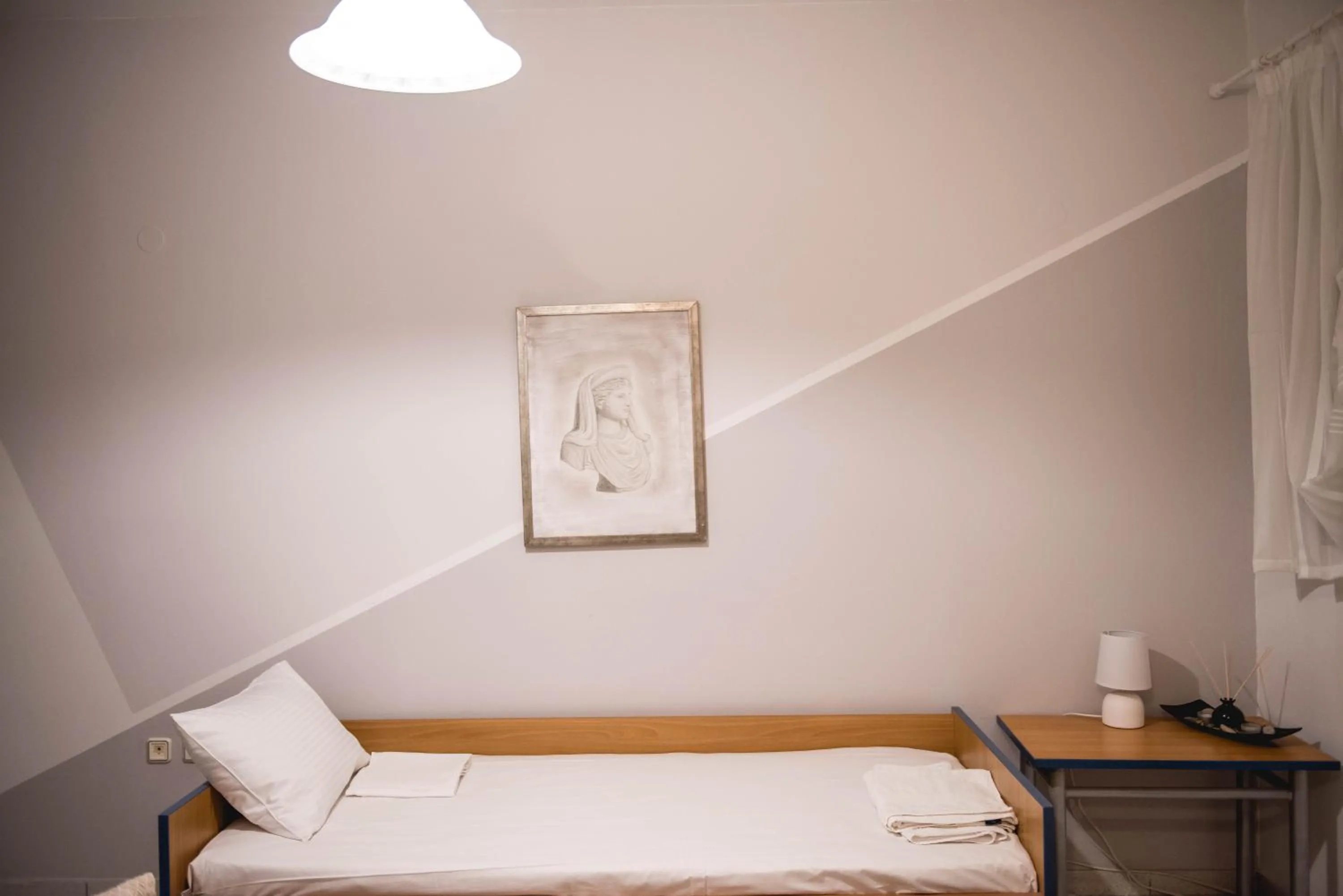 Bed in Pantheon Deluxe Apartments