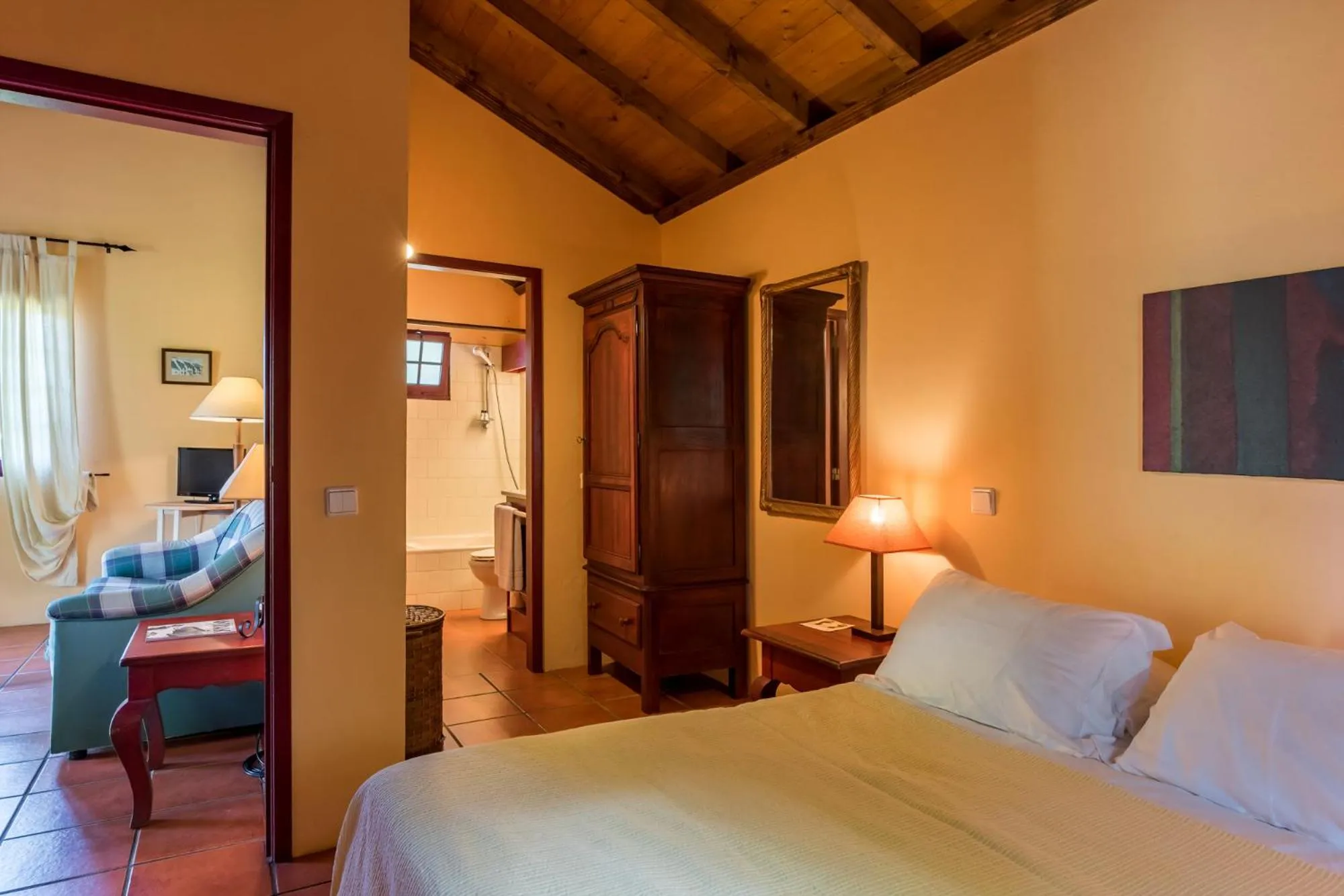 Living room, Bed in Pestana Quinta do Arco Nature & Rose Garden Hotel