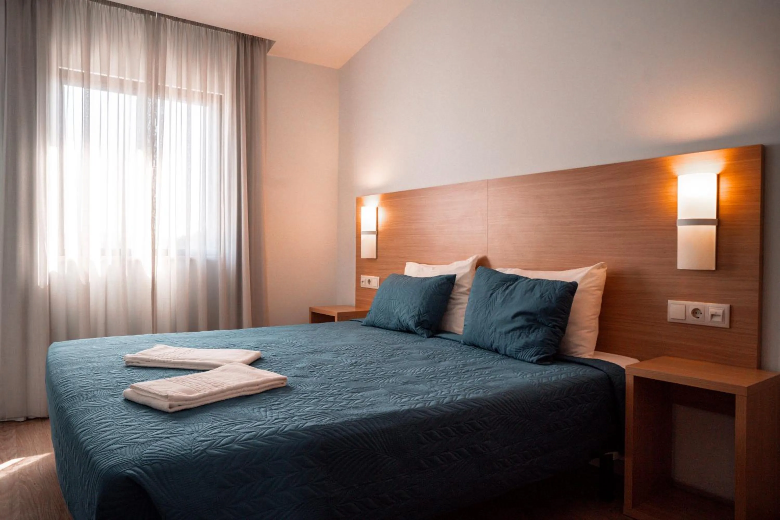 Bed in Apartamentos Honorio - Pool and Garden