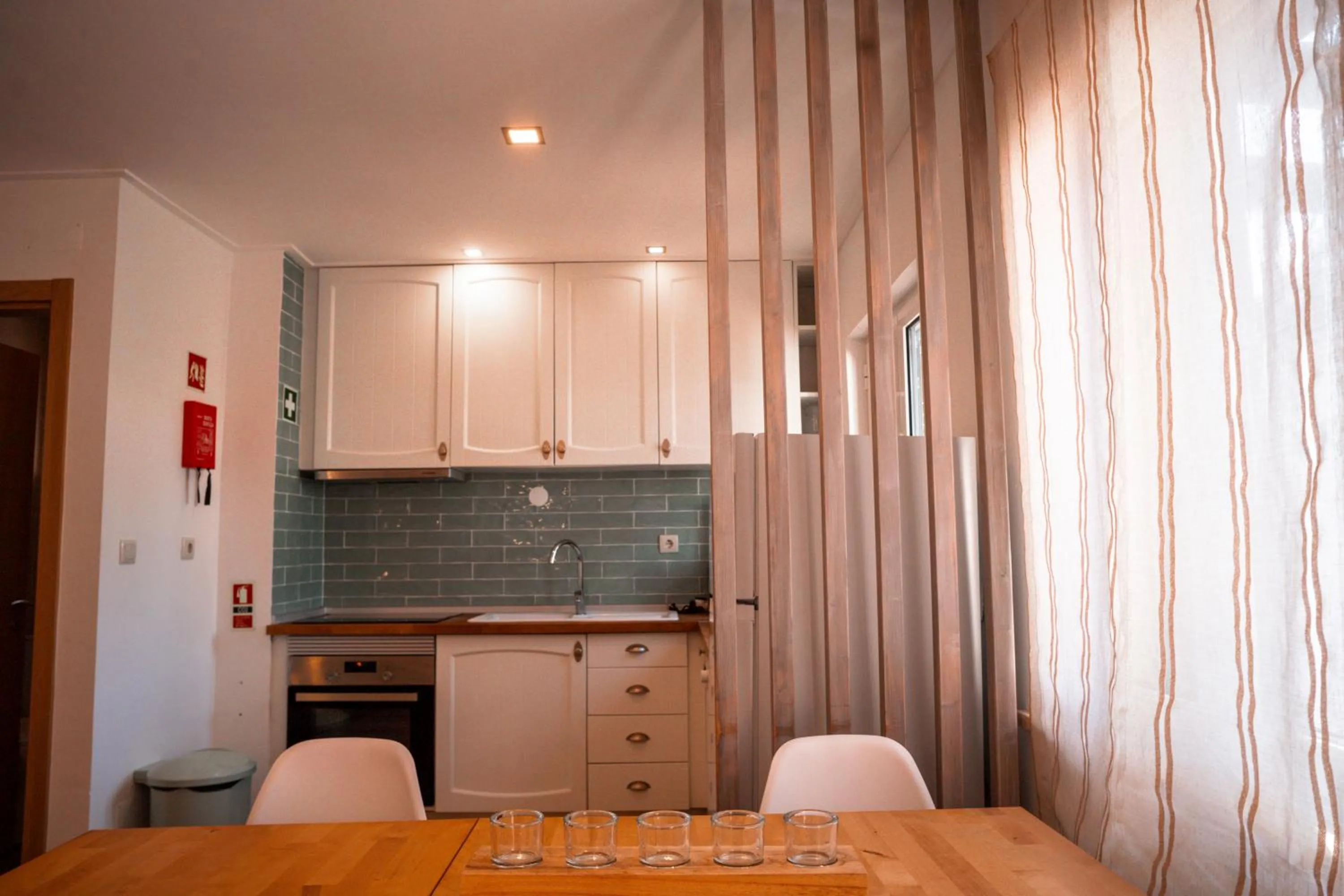 Kitchen or kitchenette in Apartamentos Honorio - Pool and Garden