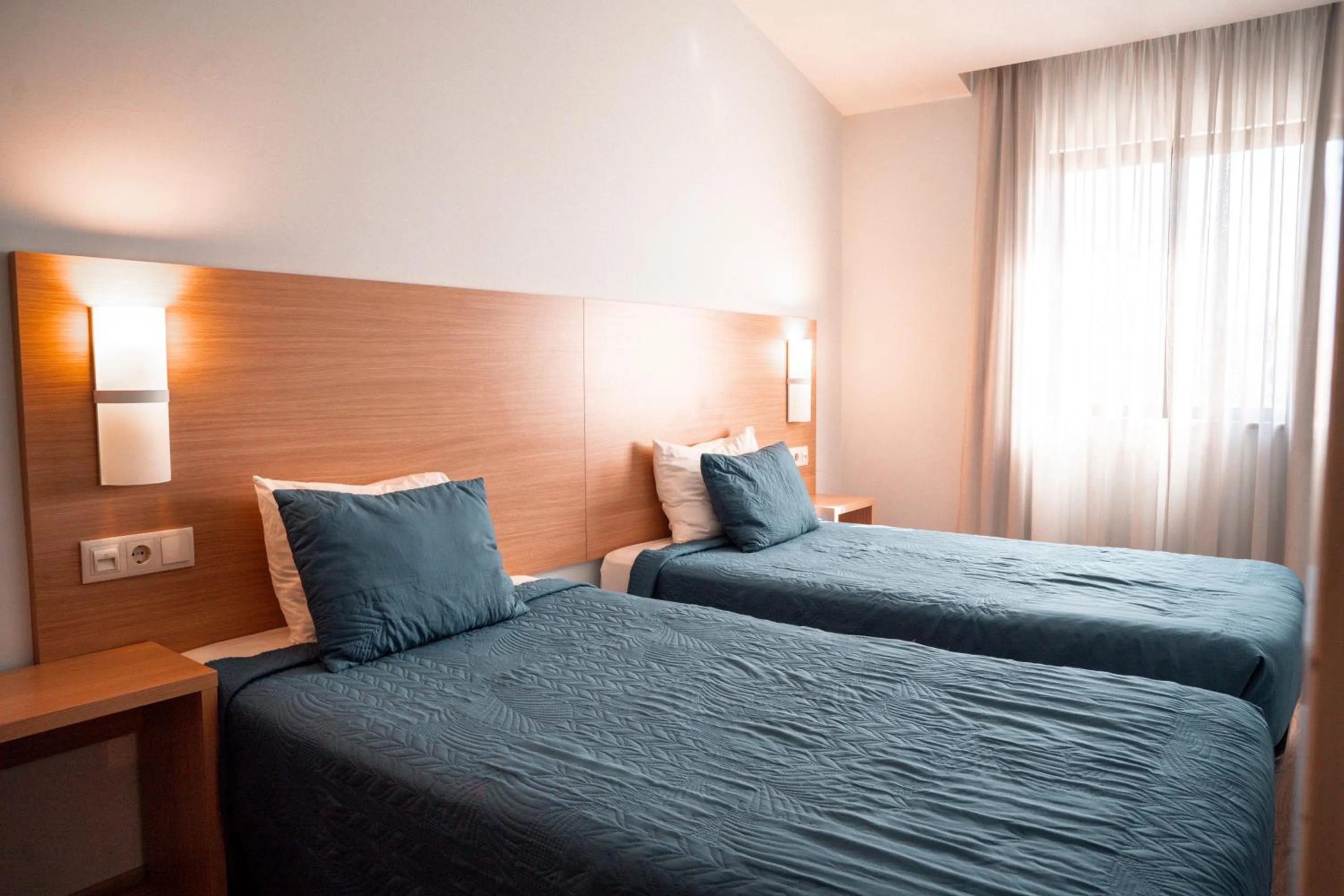 Bed in Apartamentos Honorio - Pool and Garden