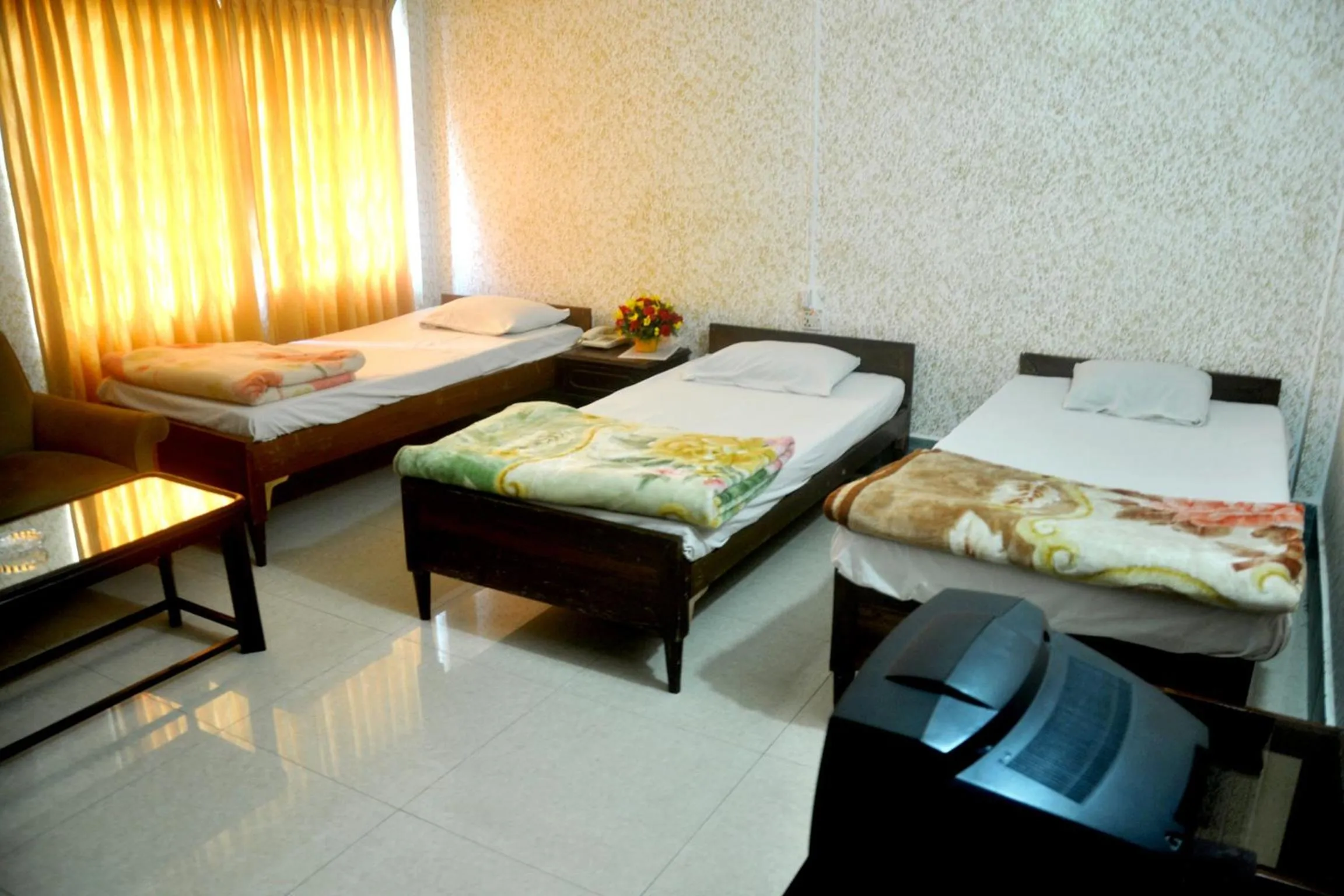 Bed in Hotel Swiss Garden International