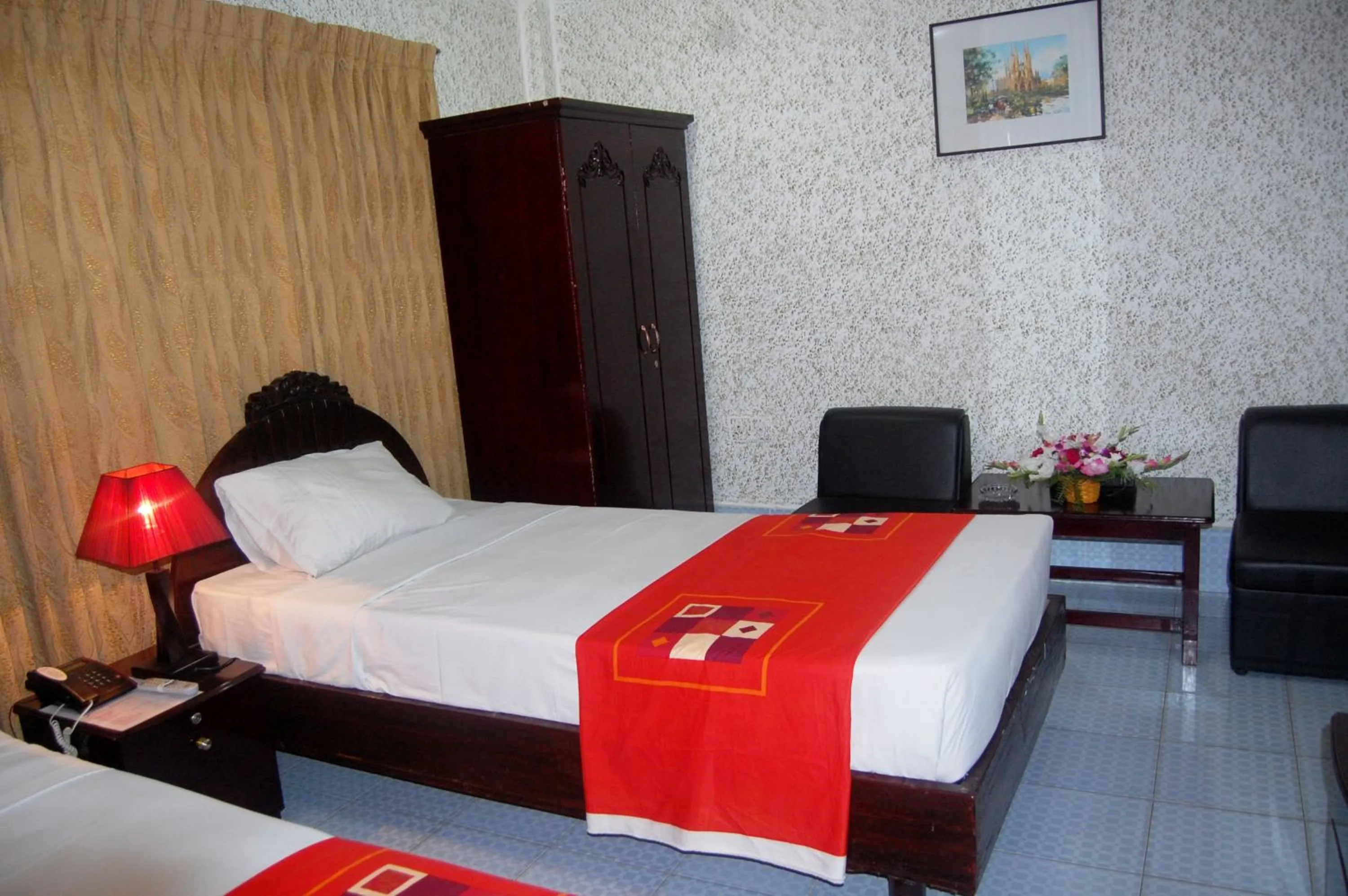 Bed in Hotel Swiss Garden International