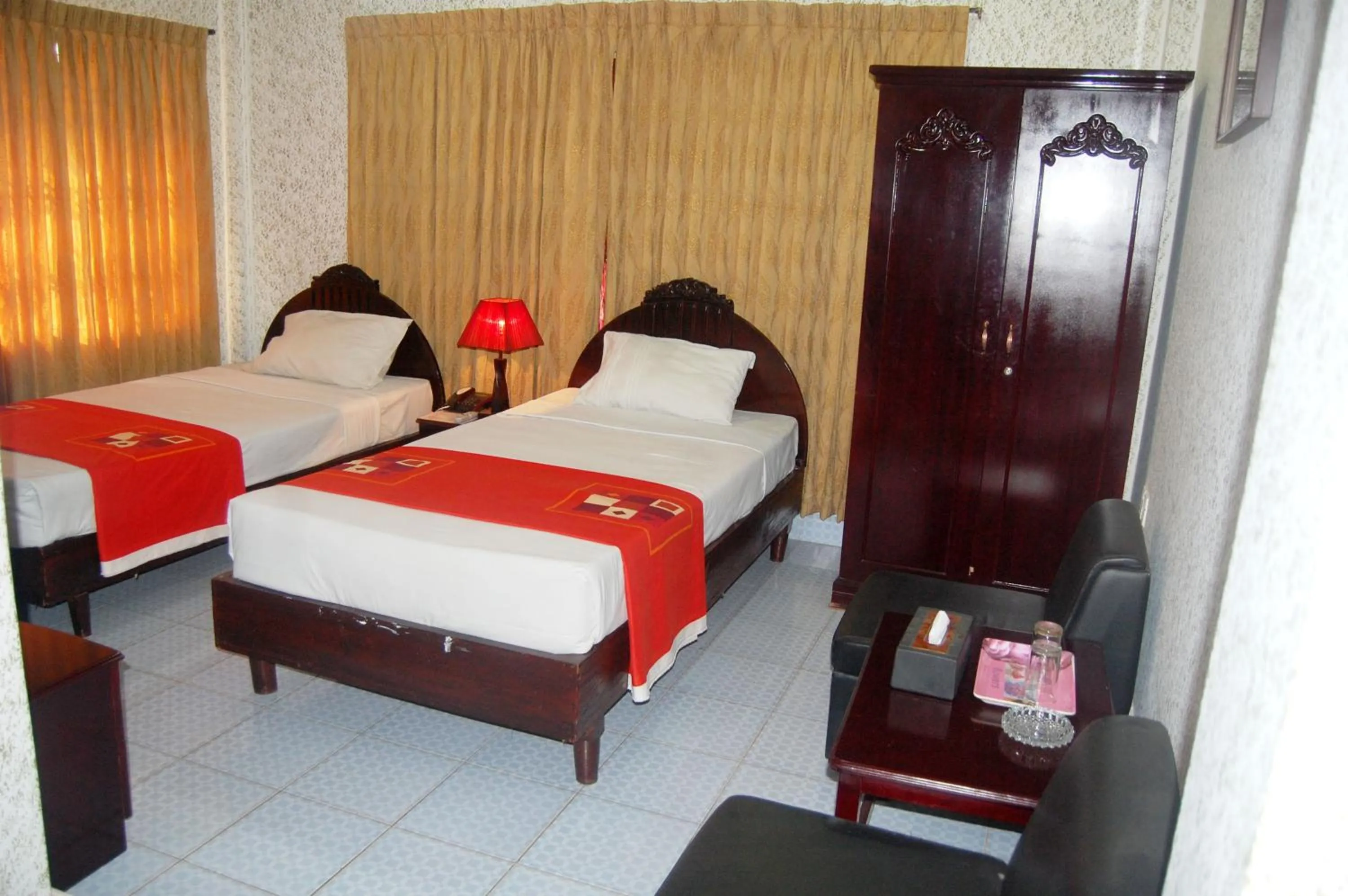 Bed in Hotel Swiss Garden International