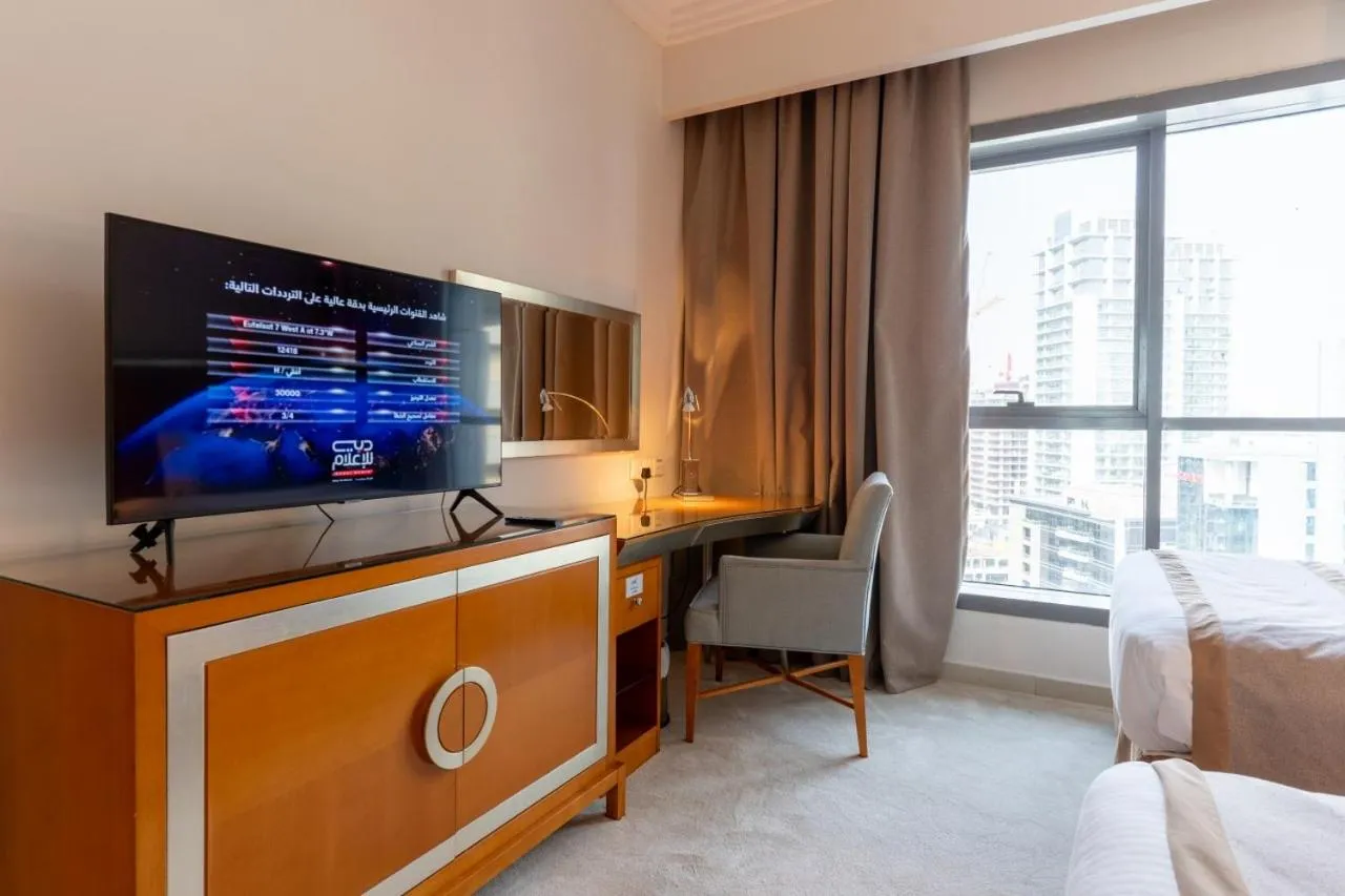 Bed in Grand Bellevue Hotel Apartment Dubai