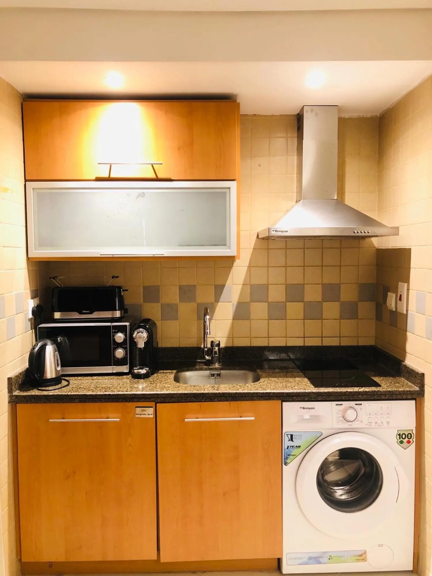 kitchen in Grand Bellevue Hotel Apartment Dubai