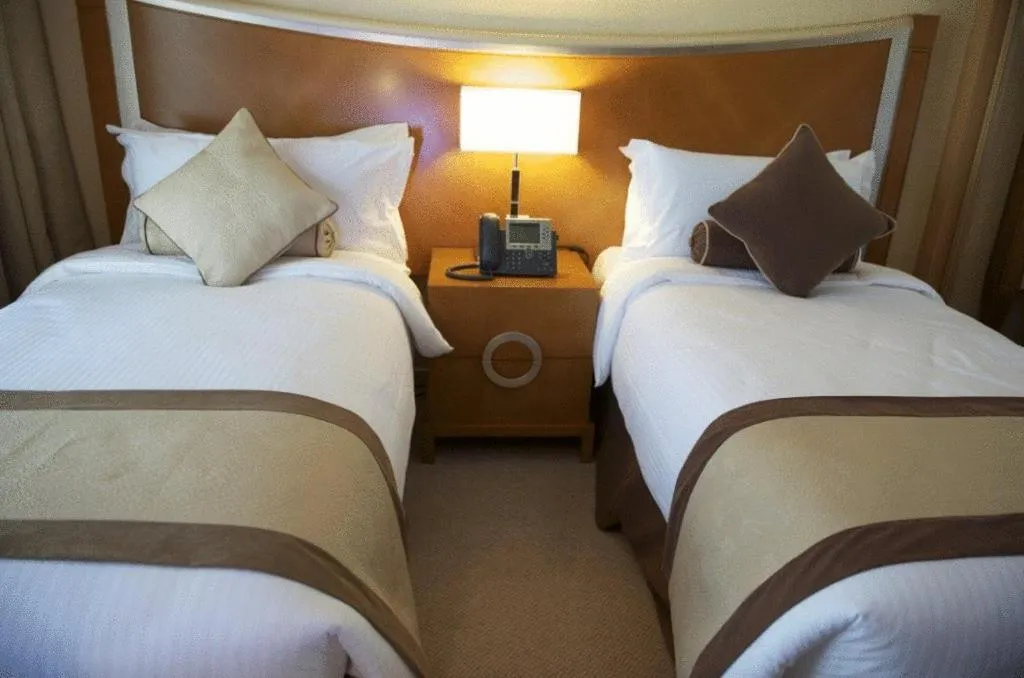 Bed in Grand Bellevue Hotel Apartment Dubai