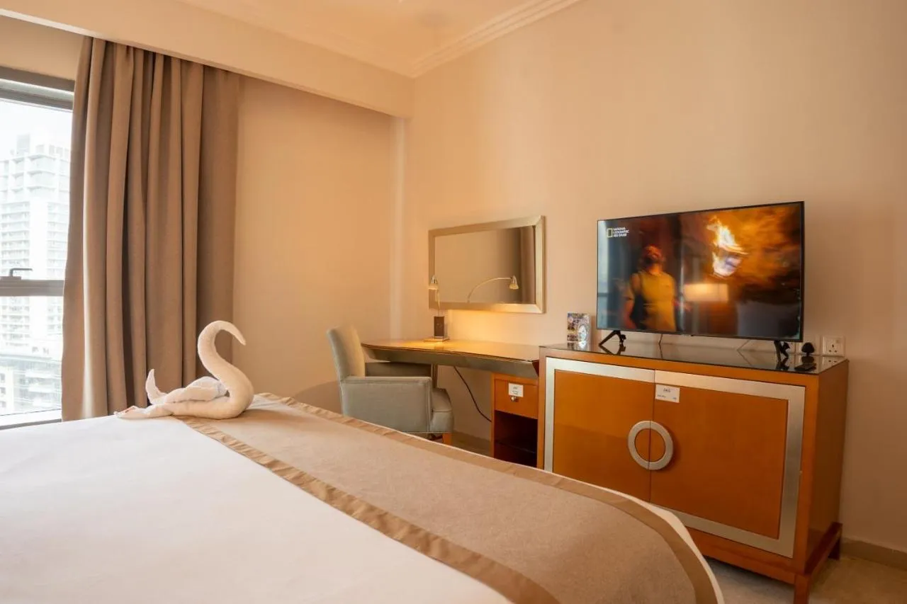 Bed in Grand Bellevue Hotel Apartment Dubai