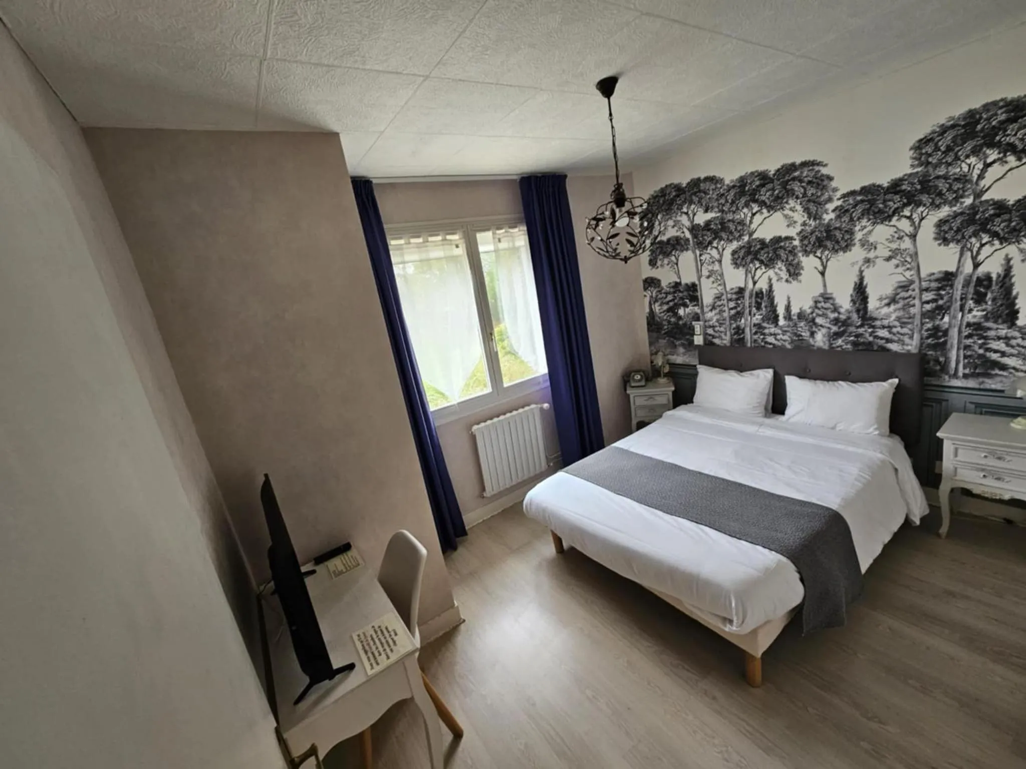 Bed in Hotel du Commerce Chez Stéphane