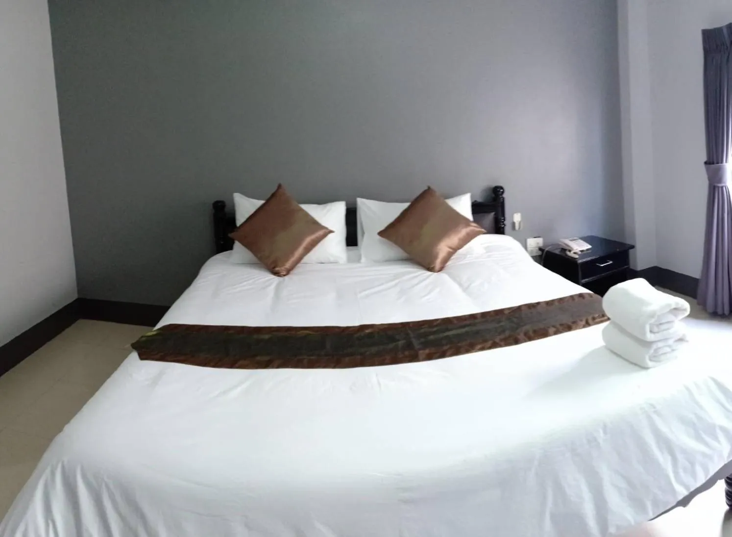 Bed in Submukda Phoomplace Hotel