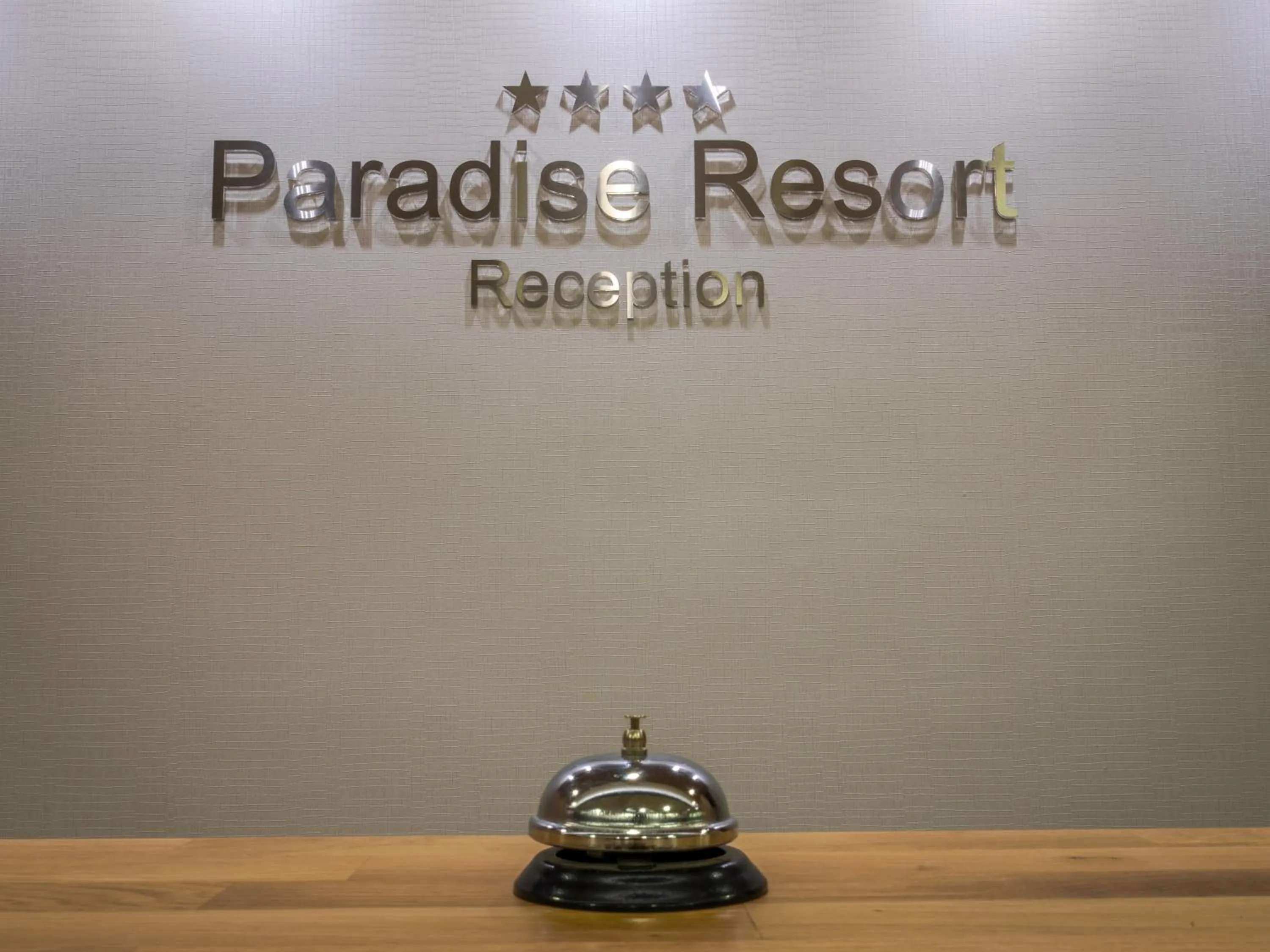 Property logo or sign in Paradise Resort