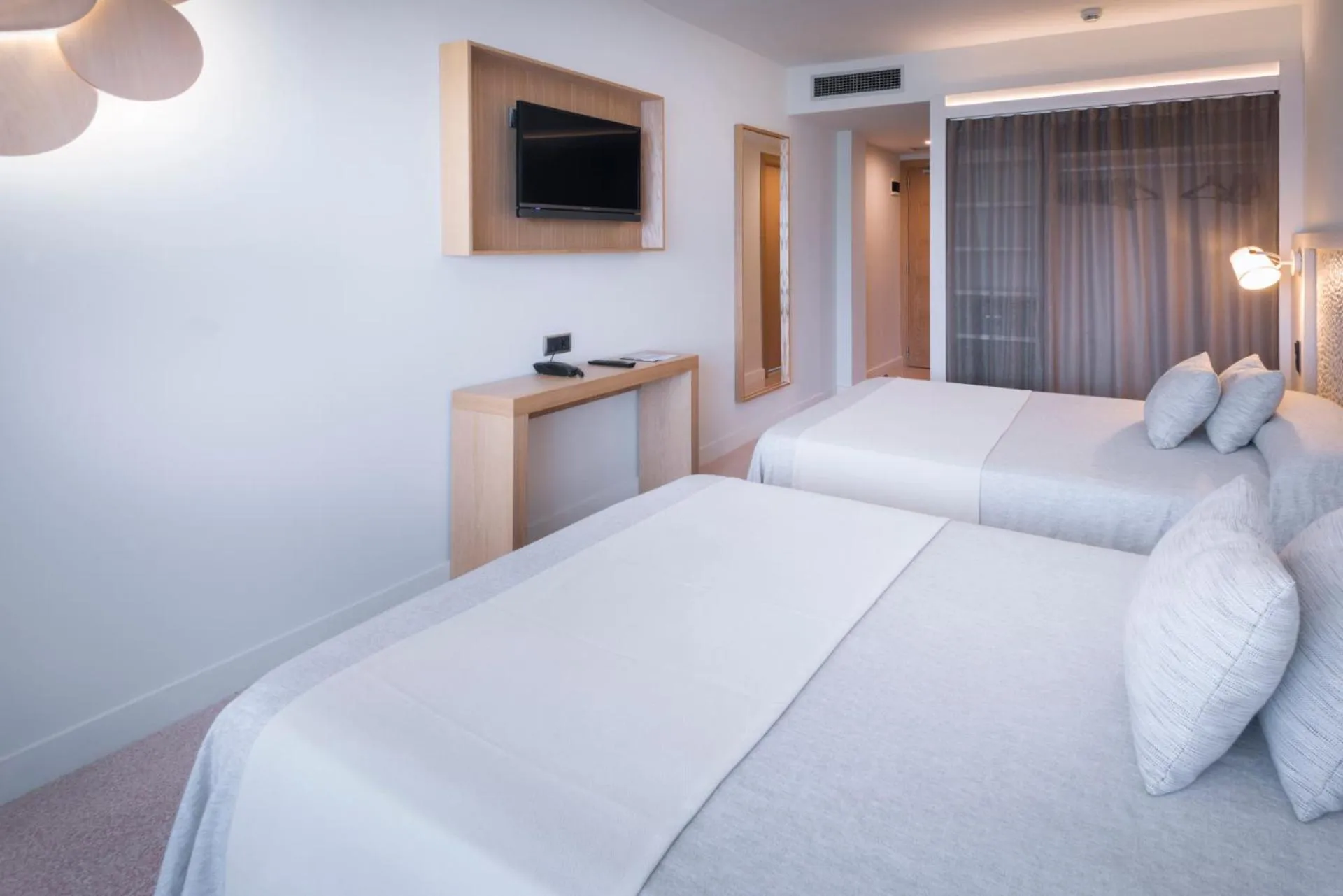 Bed in Caprici Beach Hotel & Spa