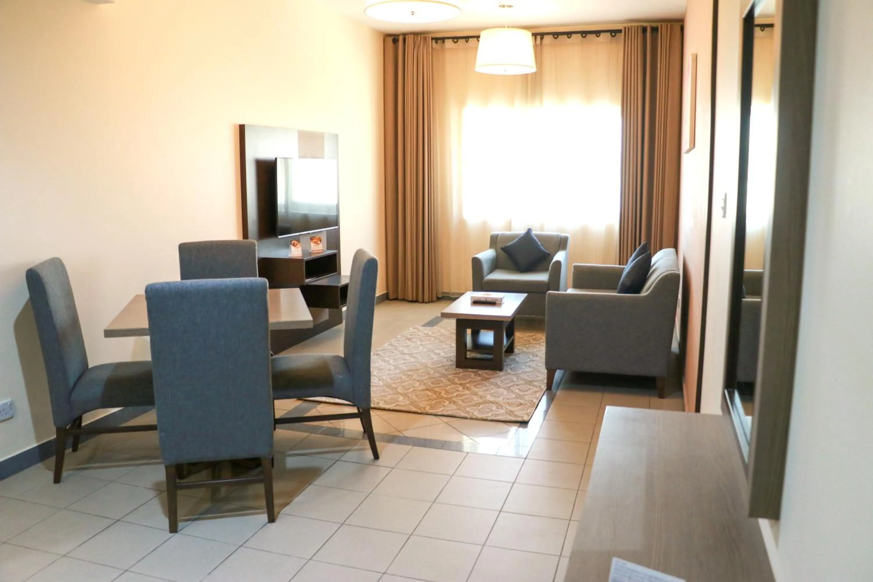 Communal lounge/ TV room in Spark Residence Hotel