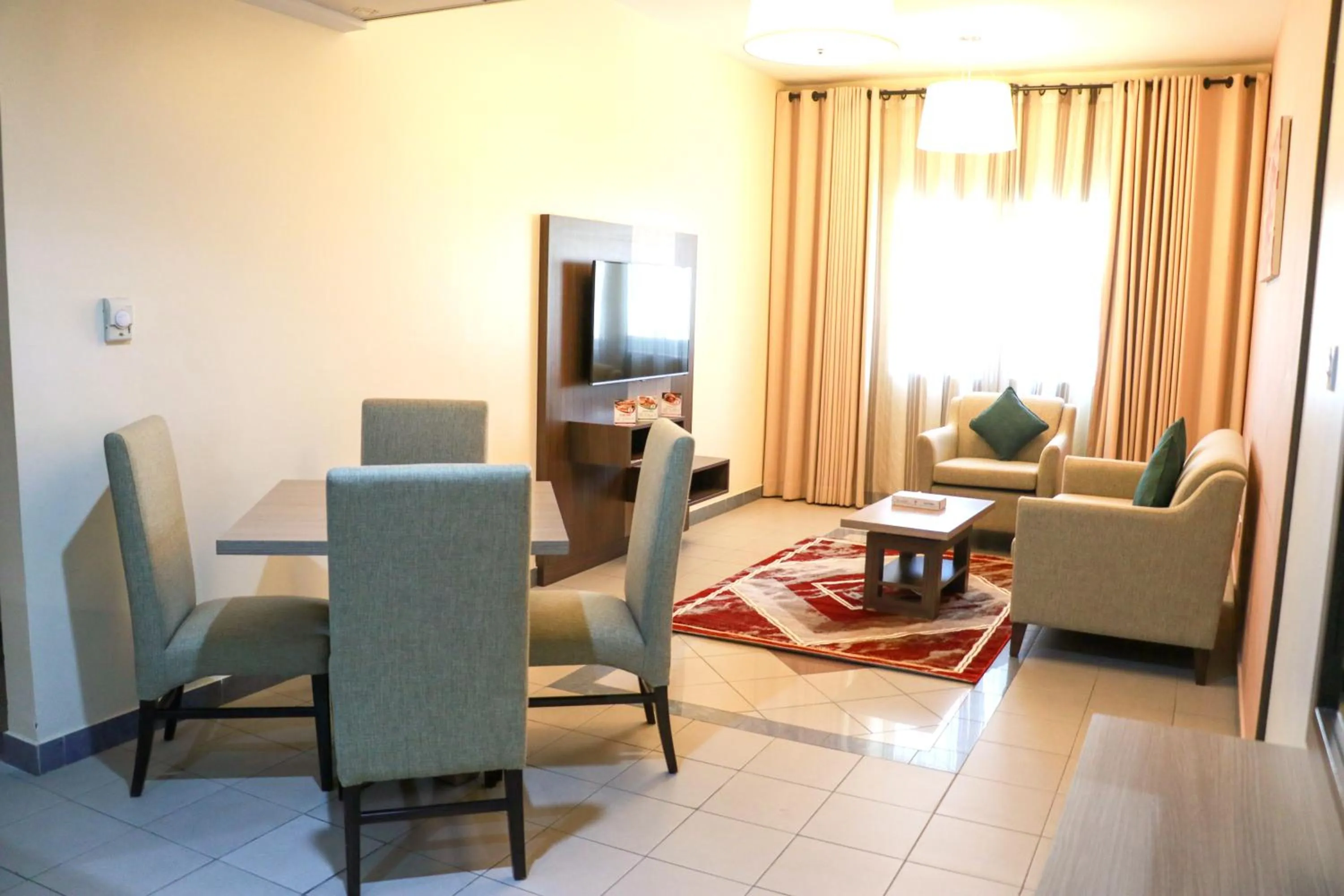 Communal lounge/ TV room in Spark Residence Hotel