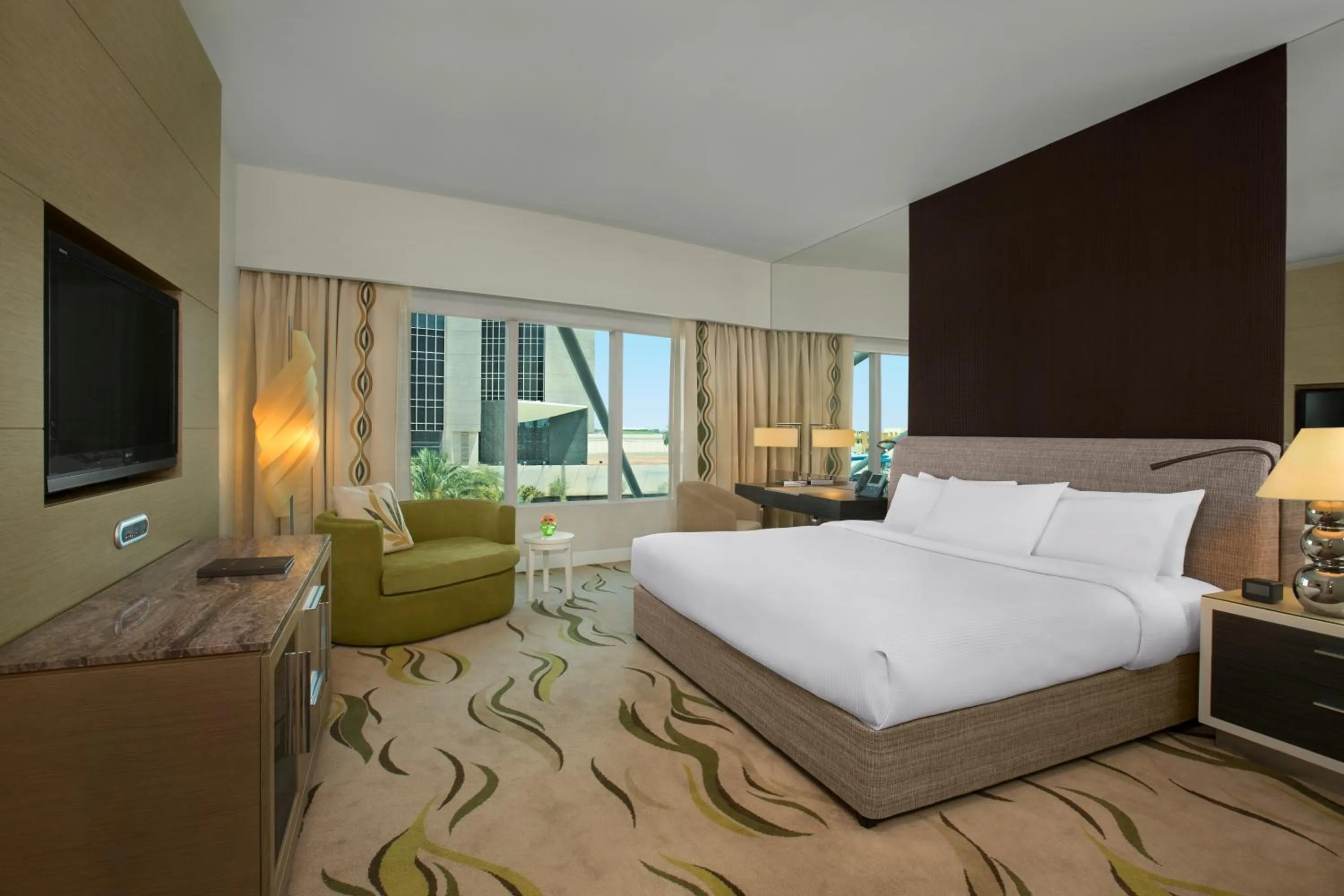 Bed in Millennium Al Rawdah Hotel